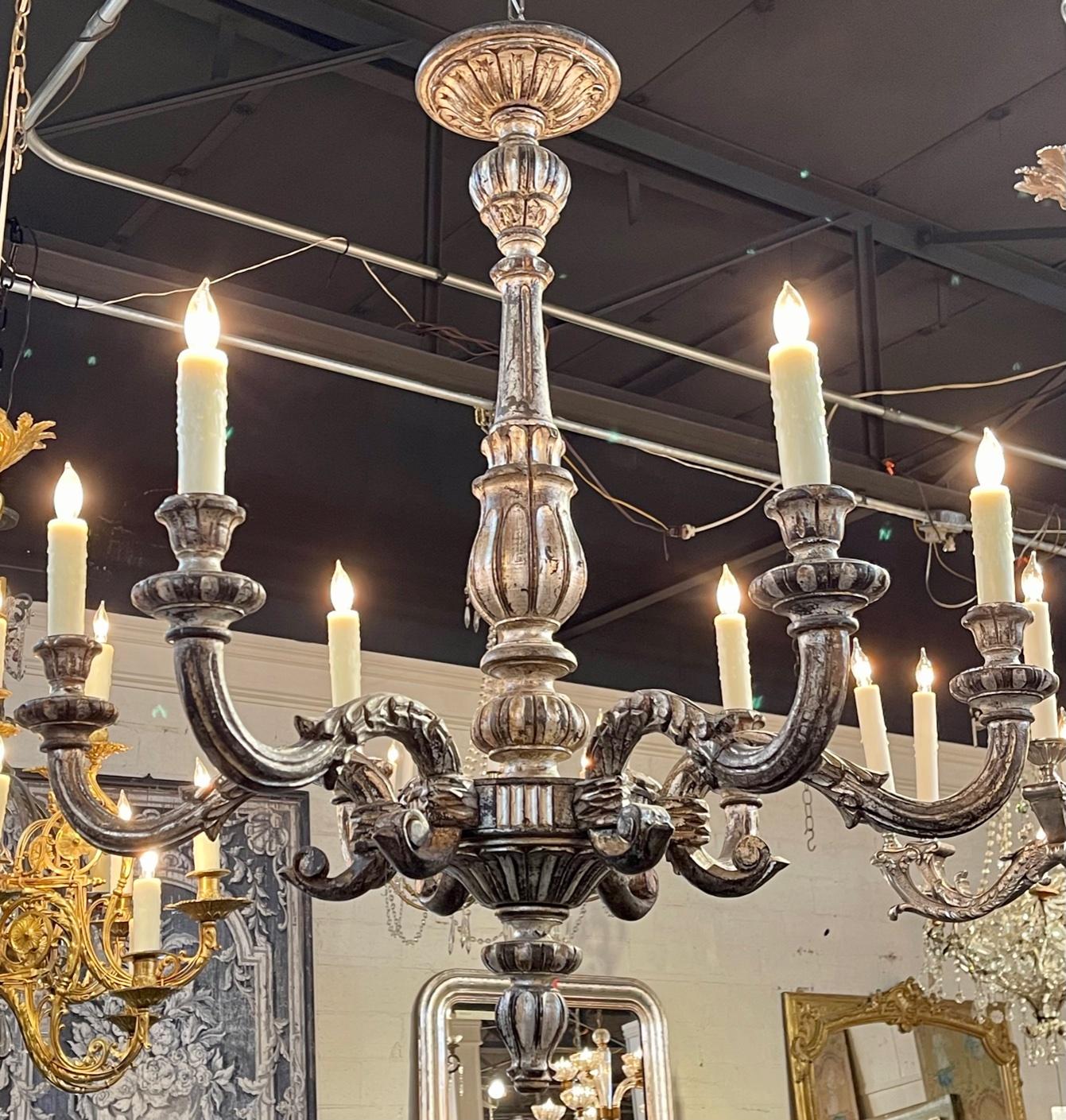 19th Century Italian carved and silver gilt wood 6-light chandelier. Circa 1890. The chandelier has been professionally re-wired, cleaned and is ready to hang. Includes matching chain and canopy. A fine addition to any home!