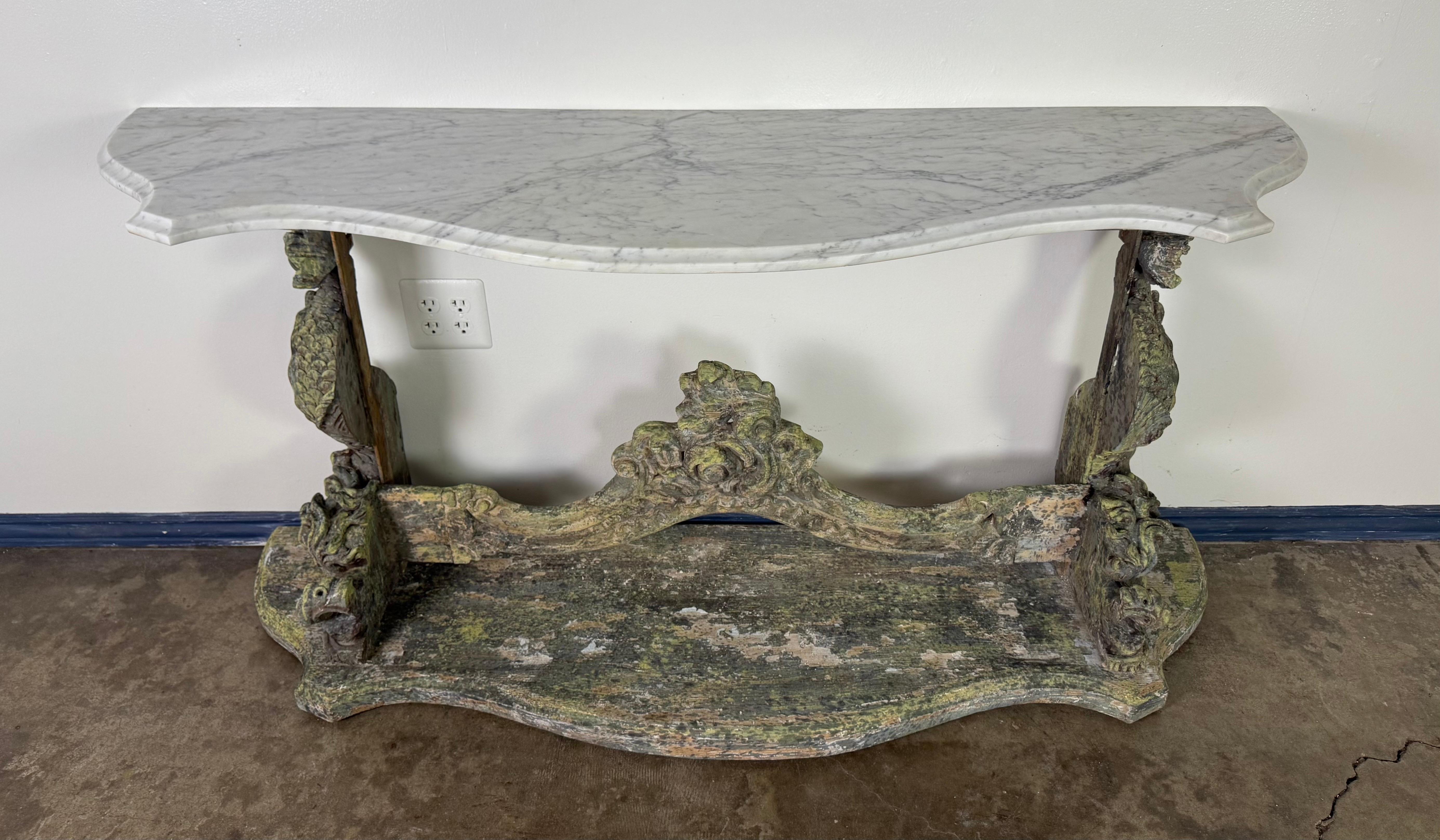 19th Century Italian Carved Console Table w/ Marble Top

An extraordinary 19th century Italian console table, richly hand-carved and crowned with a beautifully contoured white marble top. The base is crafted from solid wood and retains its original