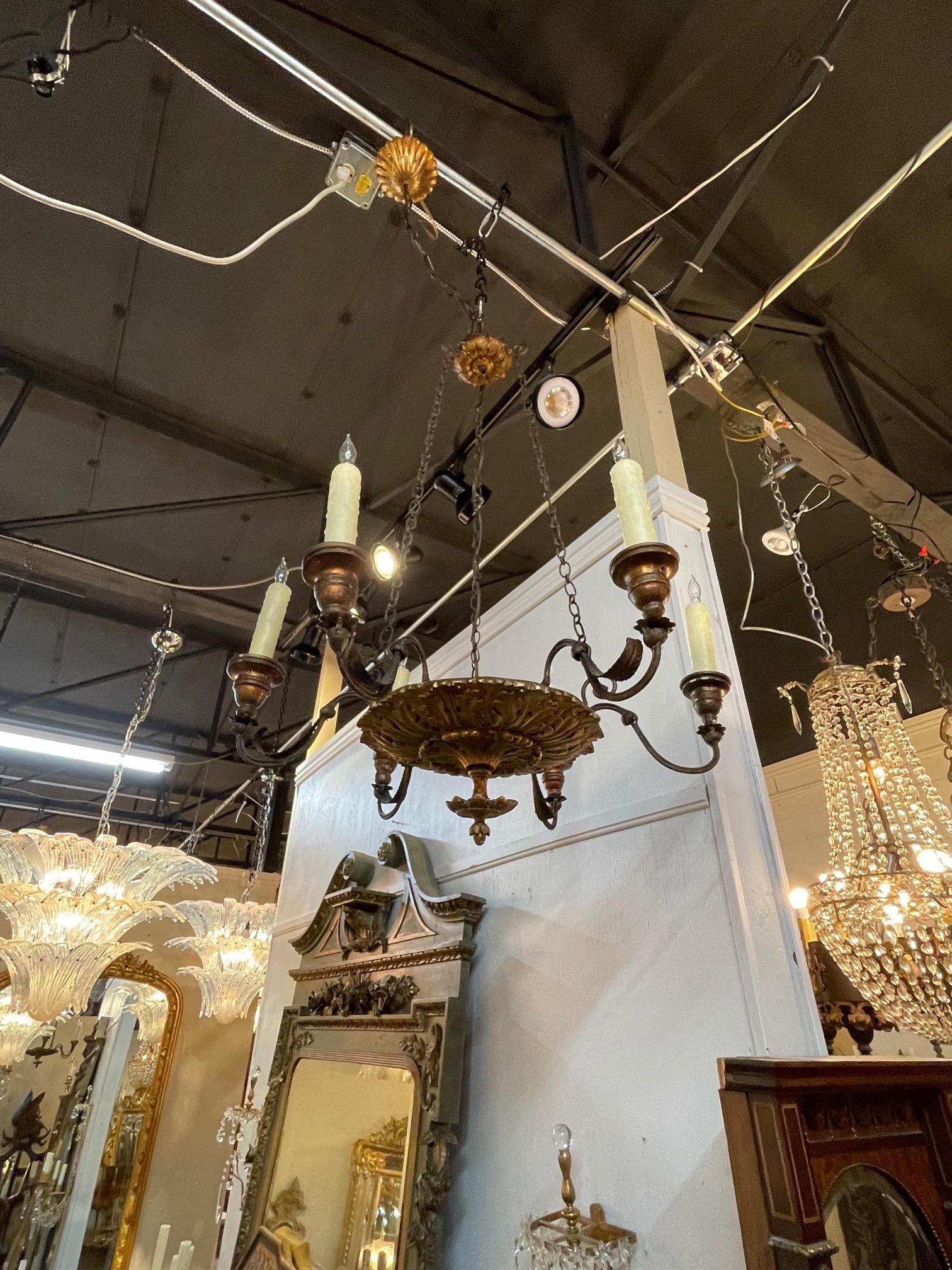 Beautiful 19th century Italian carved and giltwood 6 light chandelier. Very fine carved base and handsome decorative arms. A lovely piece that creates a touch of elegance!
