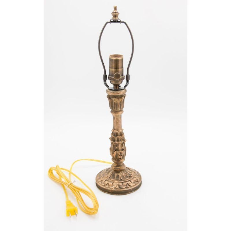 A gorgeous 19th-Century Italian hand carved gilt wood candlestick lamp. This stunning lamp has
intricate carving and a lovely patina. It's been newly rewired and is in excellent working condition.

Dimensions: 4.75