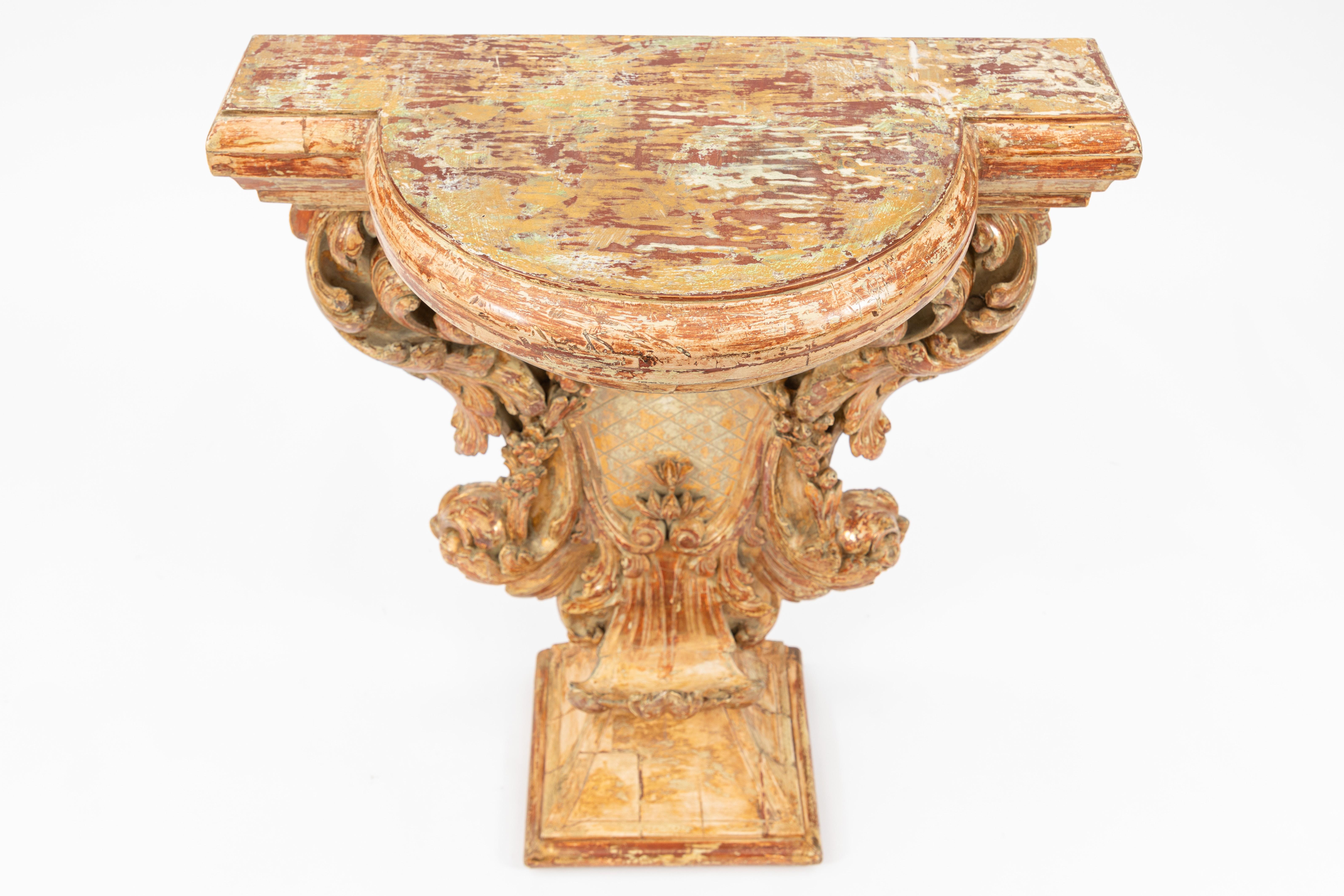 Early 19th century Italian carved giltwood console with garland motif.