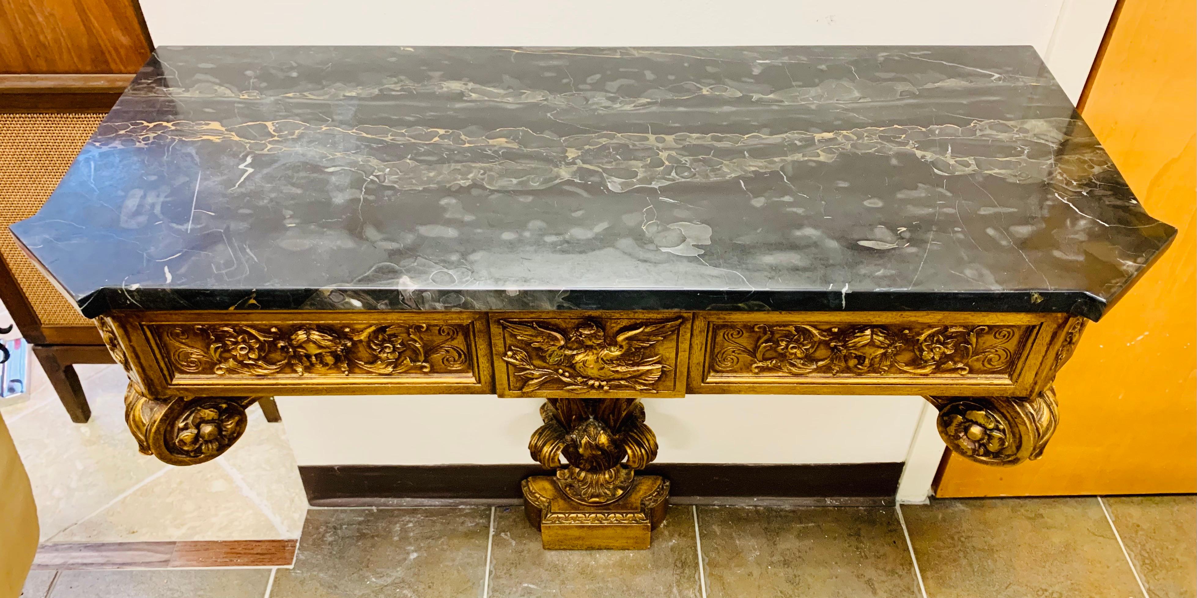 Stunning, made in Italy, neoclassical giltwood table with marble top. Demilune style that has screws for wall to support.