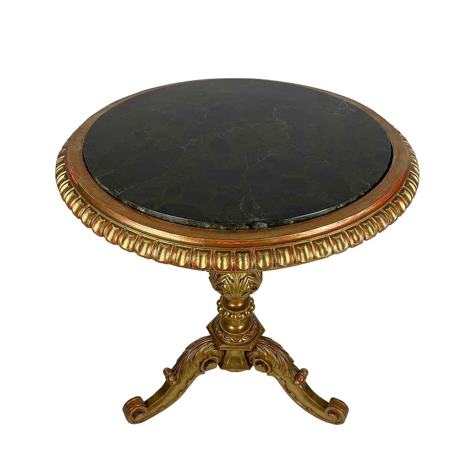 Italian carved giltwood  gueridon from Tuscany dating back to 19th  century, beautiful gold leaf gilding, acanthus leaf design carving, tripod feet and  dark green faux-marble  wooden top.
In good condition with signs of wear and use consistent with