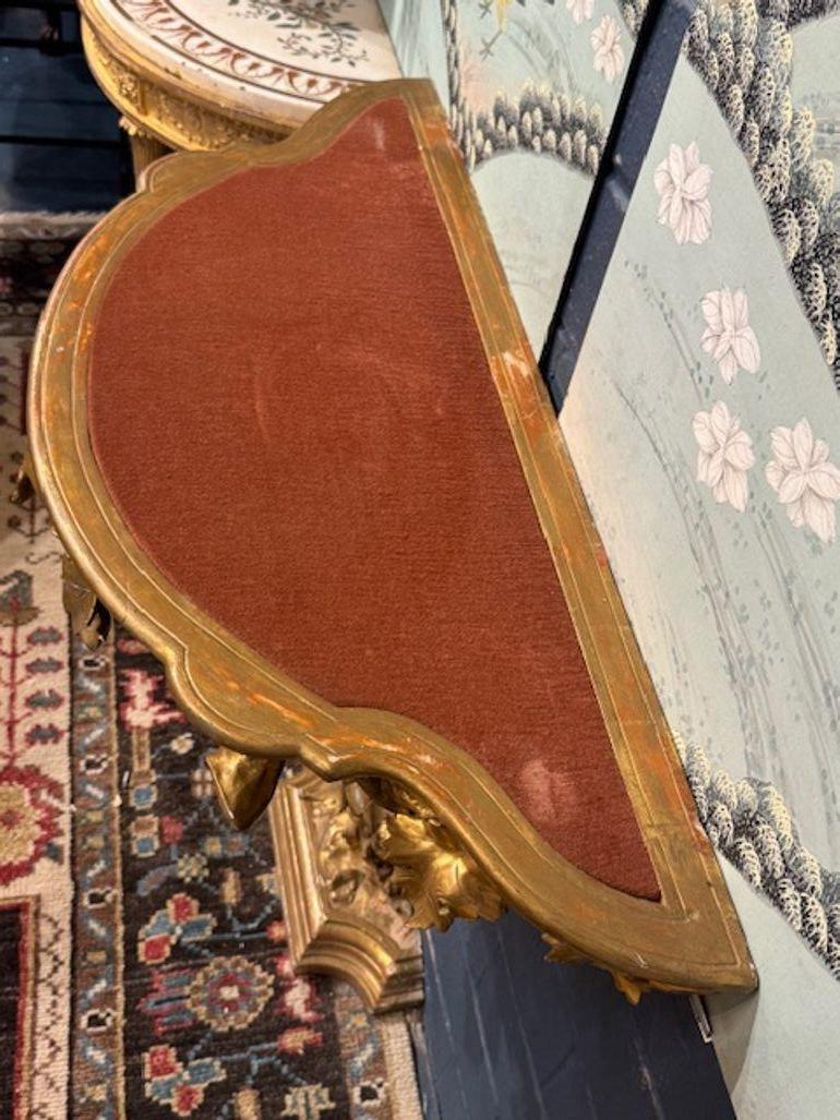 The product described is a stunning 19th century Italian carved giltwood tree form console. This elegant piece of furniture features intricate detailing and a beautiful giltwood finish, adding a touch of sophistication to any room. Its unique tree