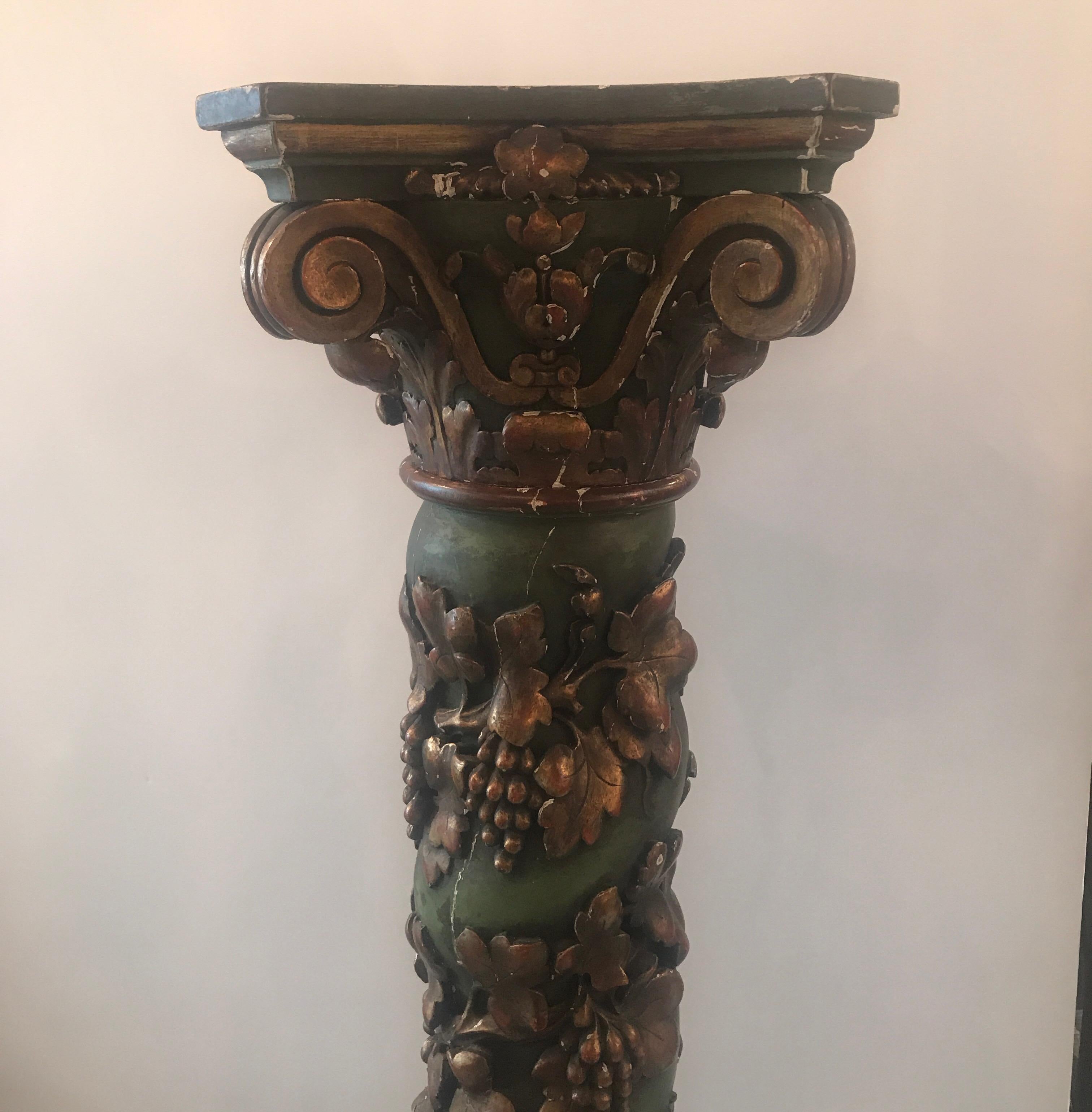 Exceptional carved solid oak poly chromed pedestal with column and grape vine motif. The original gold and green finish with expected original wear in untouched condition and displays well or can be restored.