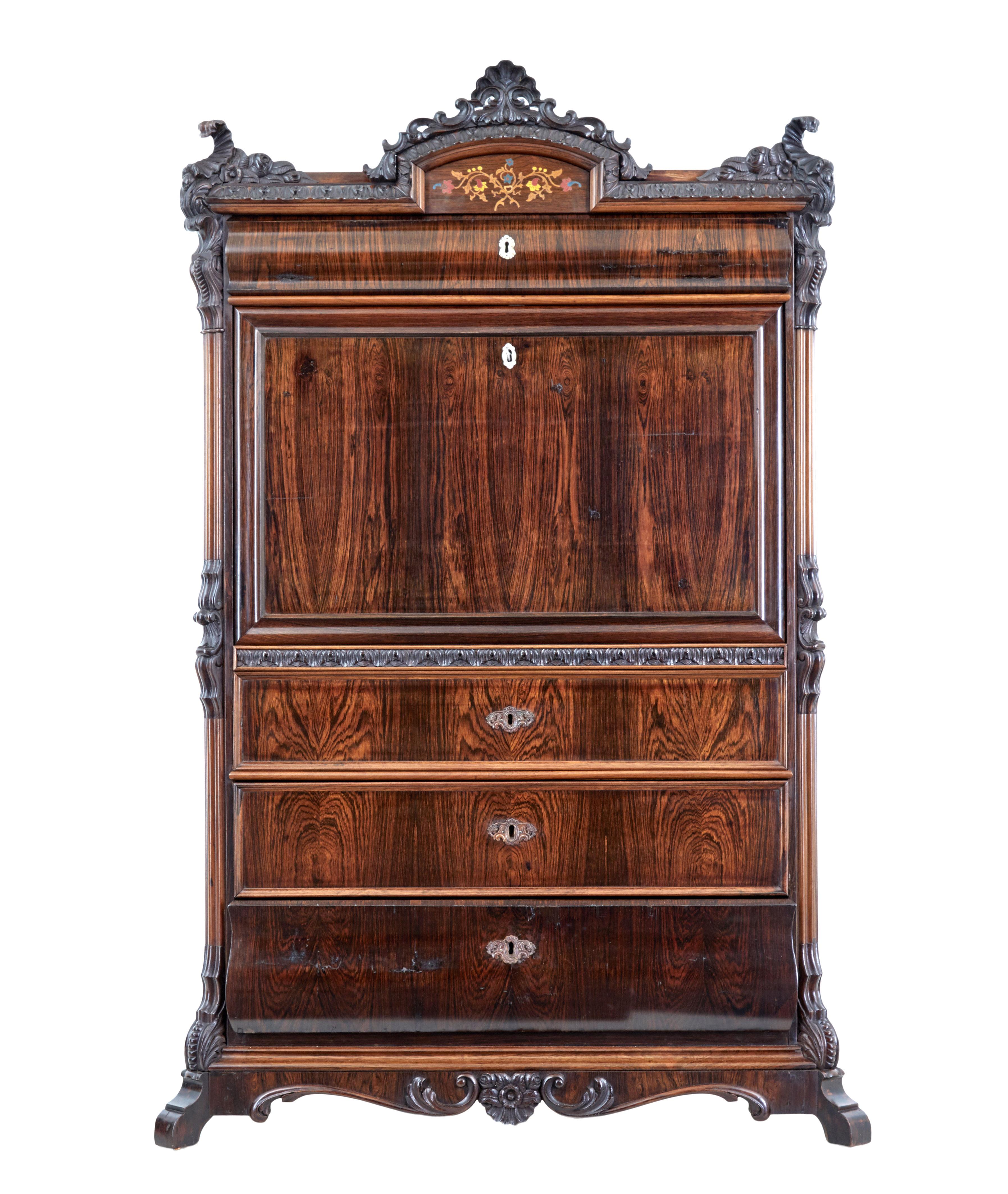 19th century Italian carved palisander escritoire circa 1880.

Nice smaller proportions on this piece, which lends itself to being able to be used in more rooms around the home.

Carved cornice with inlay. Large full width drawer, below which