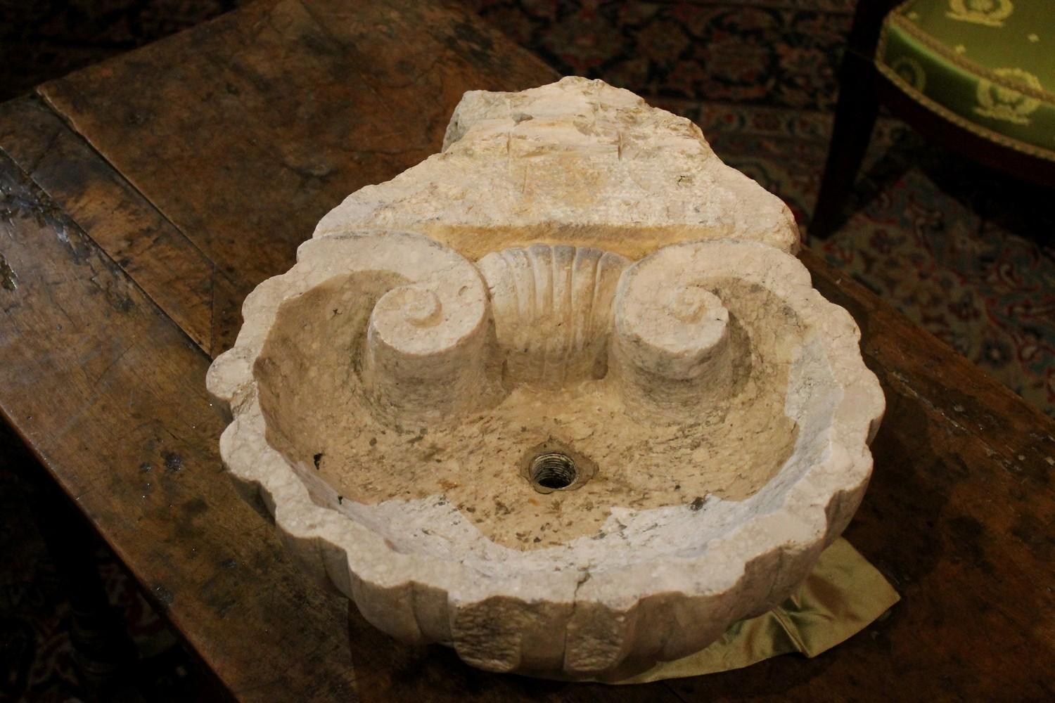 Carved in a single piece of solid rough rock, this Italian Louis XV style vessel washbasin was made with the finest and the most durable stone carved in a lovely shell form.
This white sandstone has always been produced in Italy, mostly in Rome and