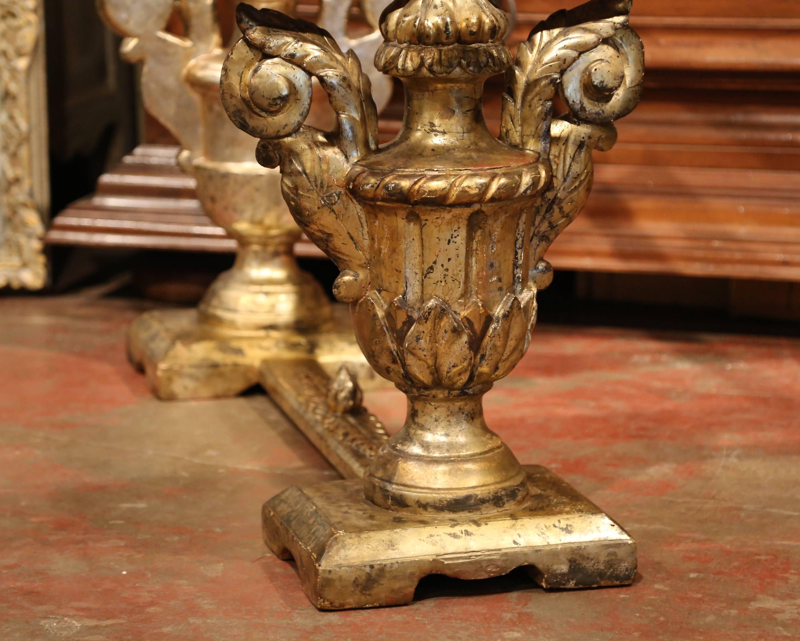 Add extra surface space to your formal living room with this elegant antique coffee table, crafted in Italy circa 1850, the cocktail table features two heavily carved vases shape pedestals embellished with handles, and connected with a stretcher
