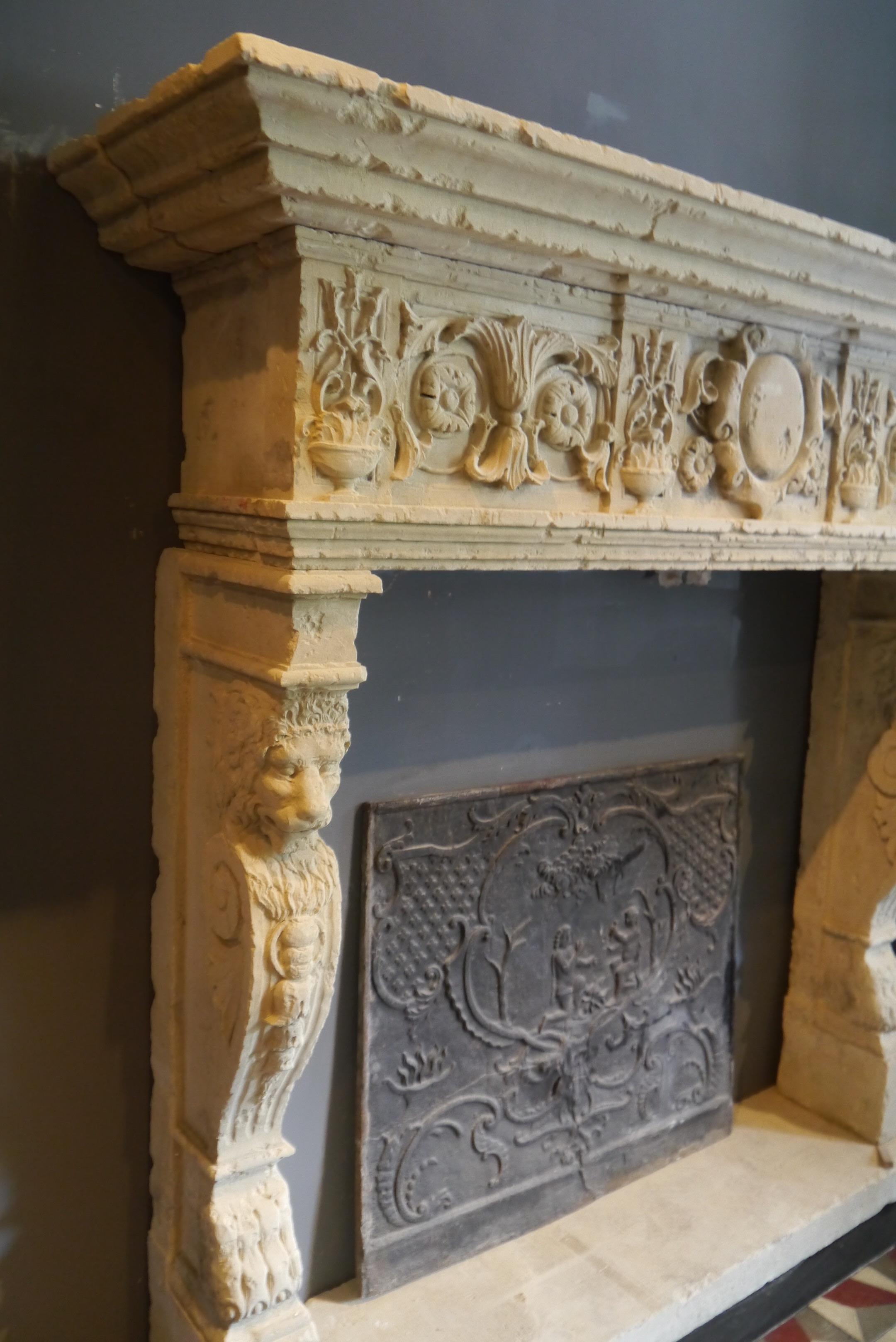 A very large 19th century carved Italian stone fireplace with lion heads on the legs and lionpaw feet. Opening size 57