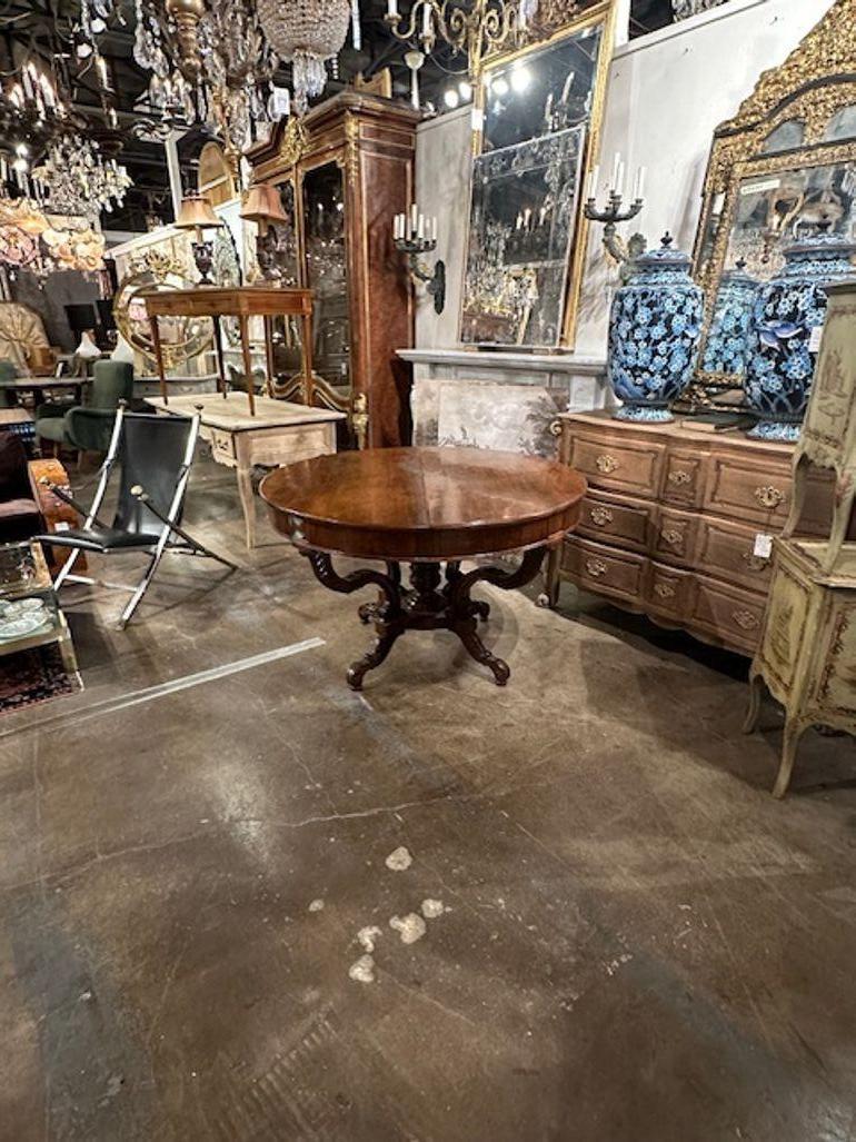 Handsome 19th century carved Walnut center table from Italy. Makes an elegant statement. Gorgeous!