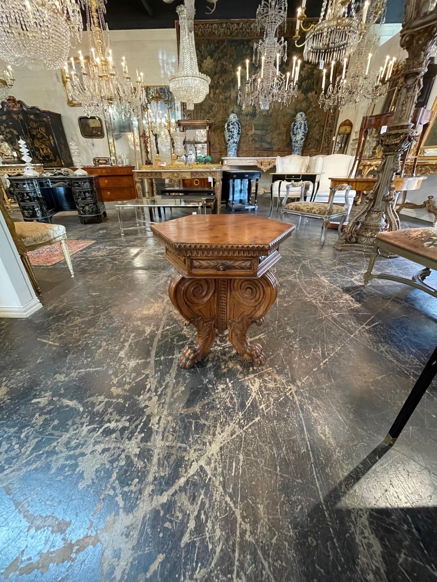 Very fine 19th century Italian carved walnut hexagonal side table. Exceptional carvings on this decorative table. 
An interesting piece!