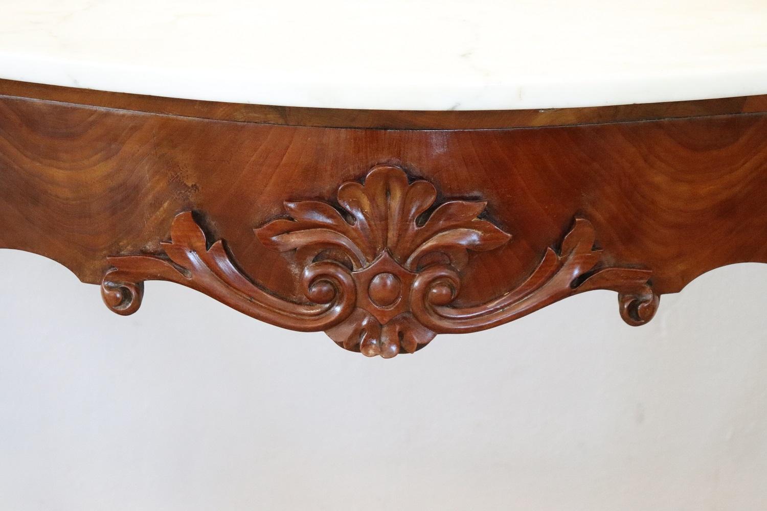 Antique console table Louis Philippe 1850s. The console is made of solid carved walnut. Elegant Italian white marble top. Rare due to its small size, perfect to be placed even in small rooms or representative entrances. You can receive perfectly