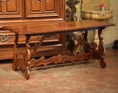 19th Century Italian Carved Walnut Trestle Table with Decorative Inlay Motifs
