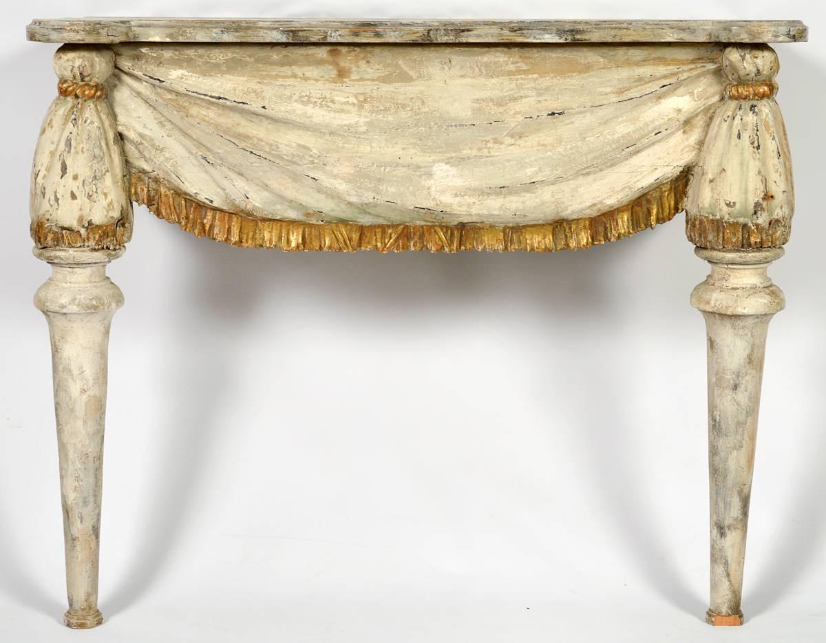 Carved Italian painted console with swag designed apron. Faux marble painted top, late 18th century or early 19th century. From a Prominent collector.