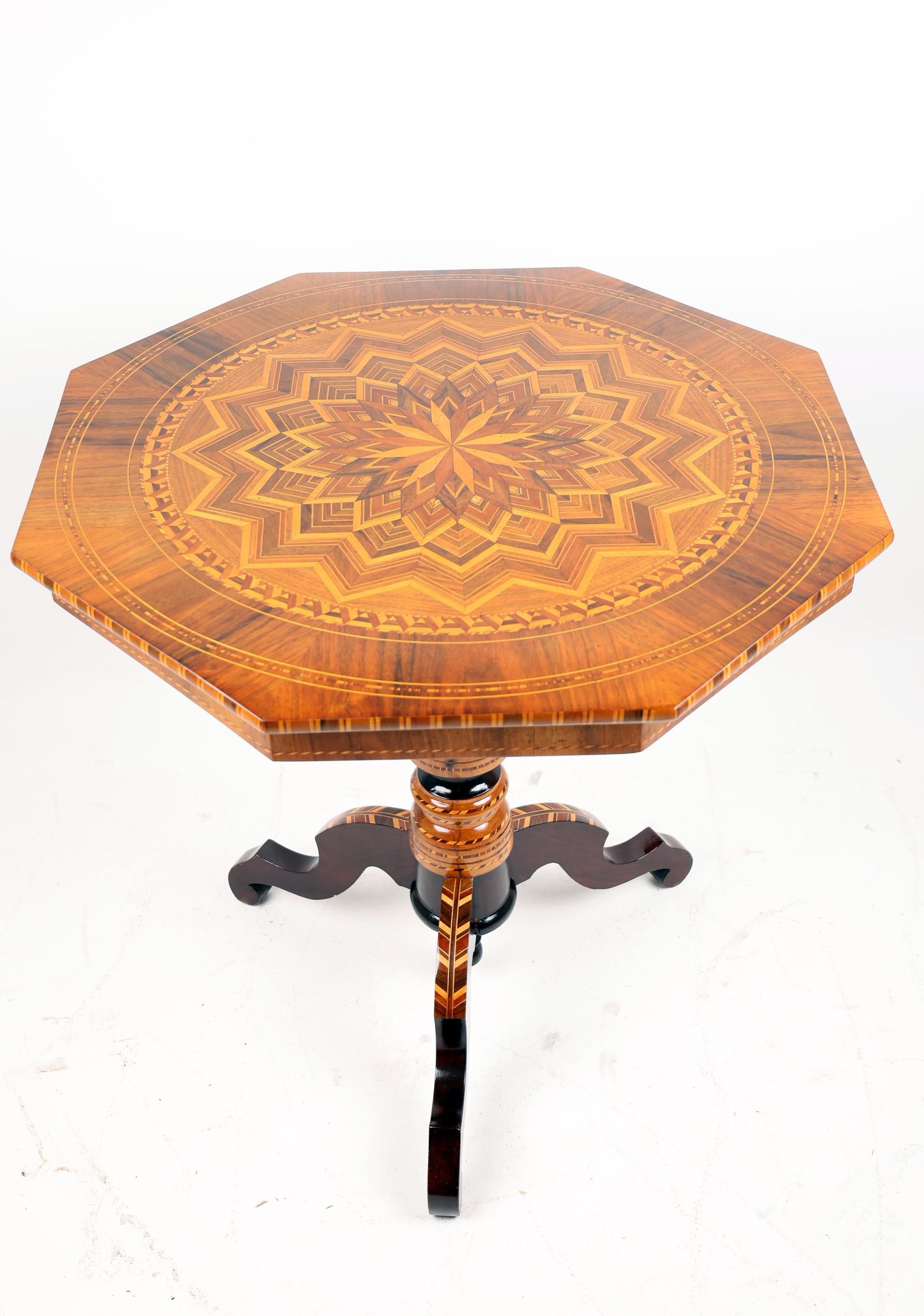 19th Century Center table with marquetry,
Italy, Ca.1860
Walnut with fruit woods,

Late 19th century Italian octagonal center table with marquetry top inlaid with walnut and various fruit woods. The tripod base also inlaid with geometric patterns.
