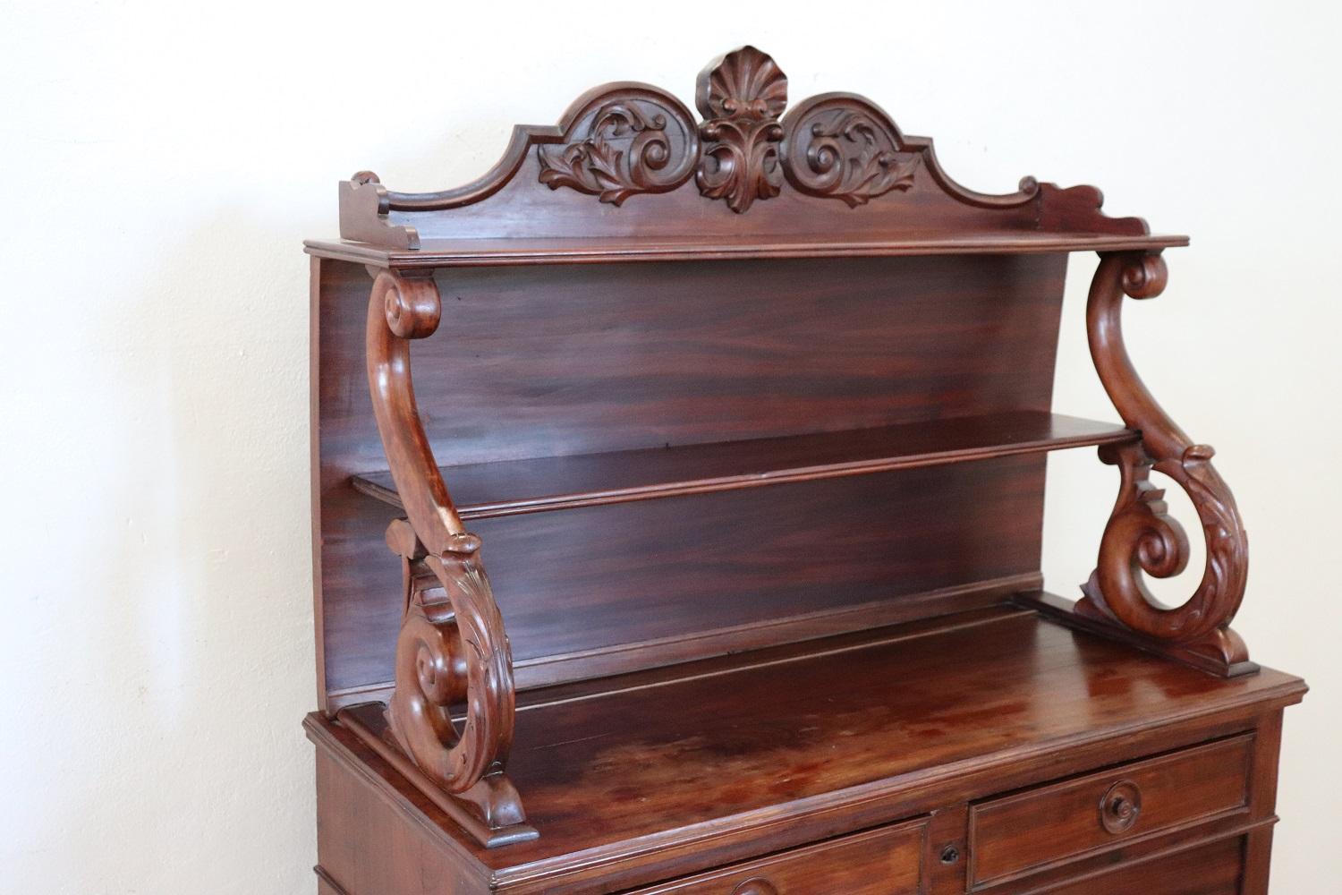 Beautiful Charles X sideboard in solid mahogany wood made in 1825s. The line is simple and essential, perfect to be placed also in a modern environment. Beautiful patina of wood. In the upper part there is a beautiful decoration carved in wood. Good