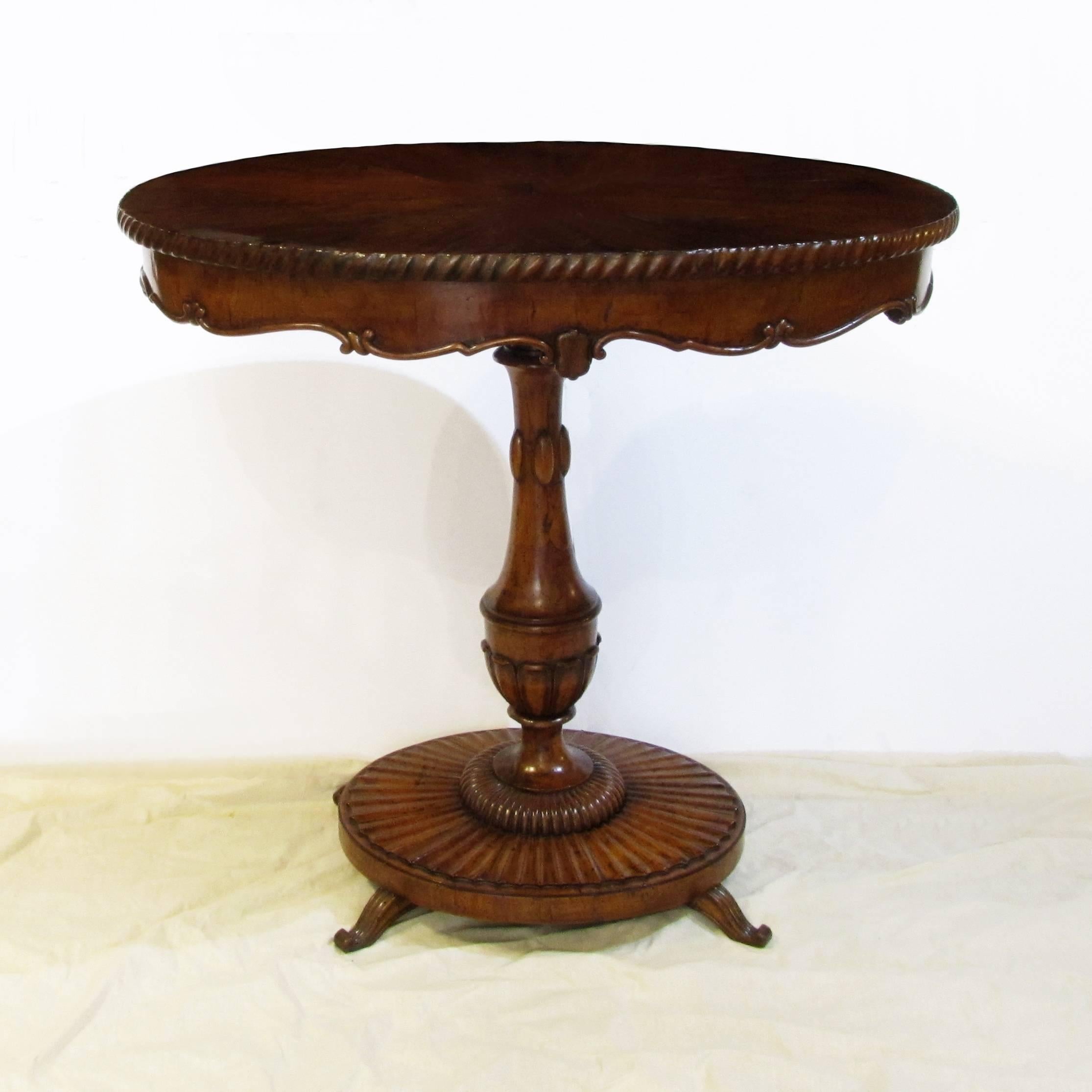 A charming early 19th century small Tuscan centre table.
Beautiful oval inlaid walnut briar root table top above carved pedestal in the form of an amphora.
Beautiful carved oval base with four small scrolled feet.
Close to the style of the