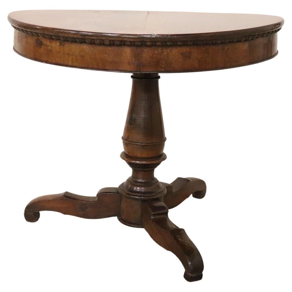 Beautiful important Charles X antique round center table, 1825. The large and solid central stem in turned walnut. The solid walnut top is of great value. This center table is perfect for a large entrance or to embellish a living room. The table