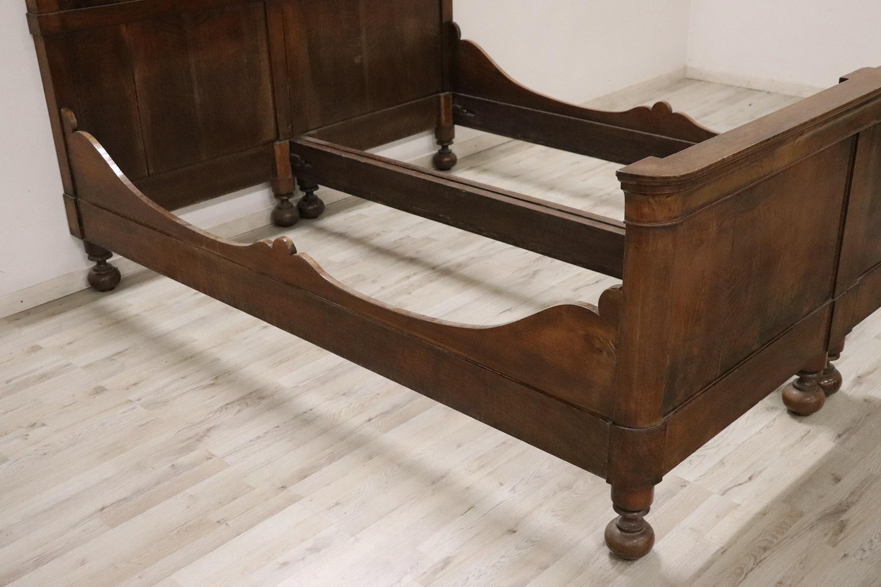 Beautiful antique Italian antique double bed Charles X 1825s. The bed is completely in solid walnut with a beautiful patina. This bed has been restored so it will be delivered in perfect condition ready to be used in your home. Net and mattress are