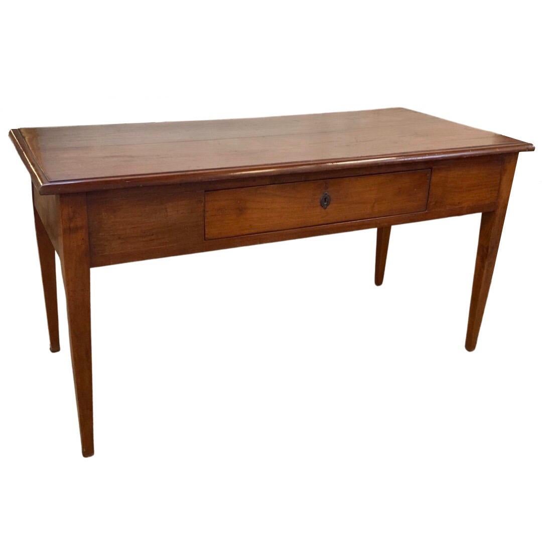 Farm table made in Italy in the early 1800s using cherry and pegged construction. This is a very simple and clean-lined table that would be a great addition to any household looking for a sturdy kitchen table that marries the idea of elegant and