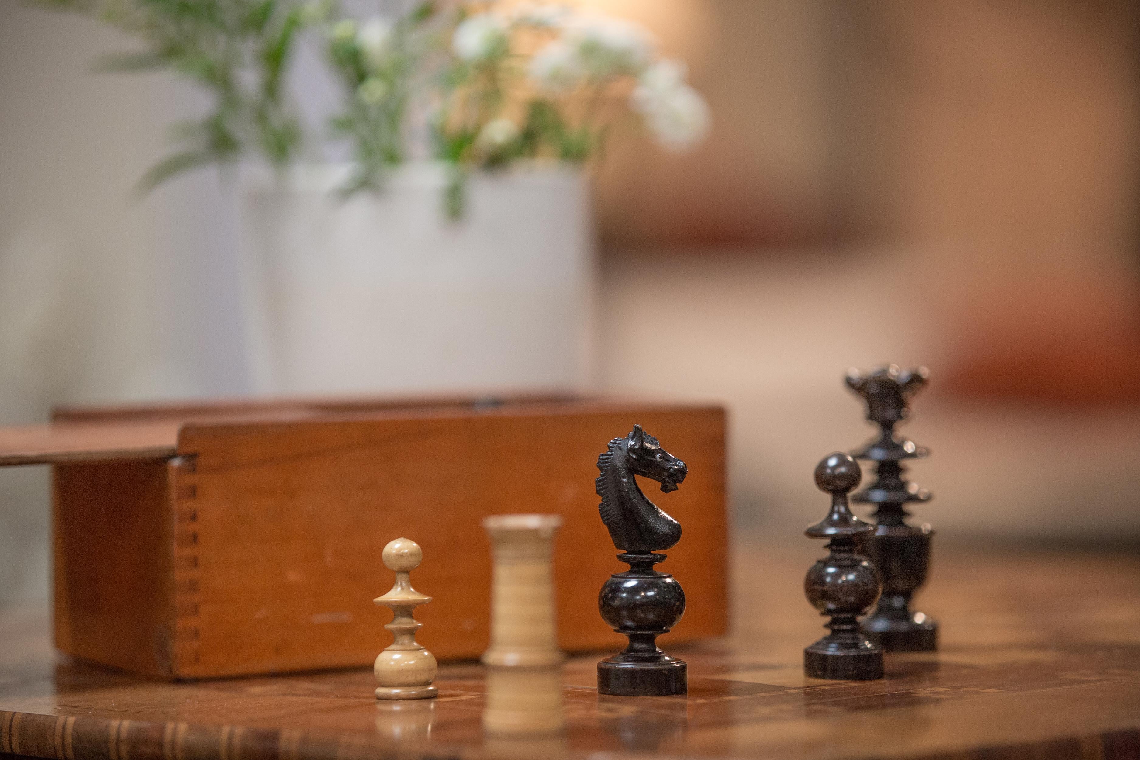 Chess set in Ash, circa 1860. Ranging in height from 2-inches to 3.75-inches tall.