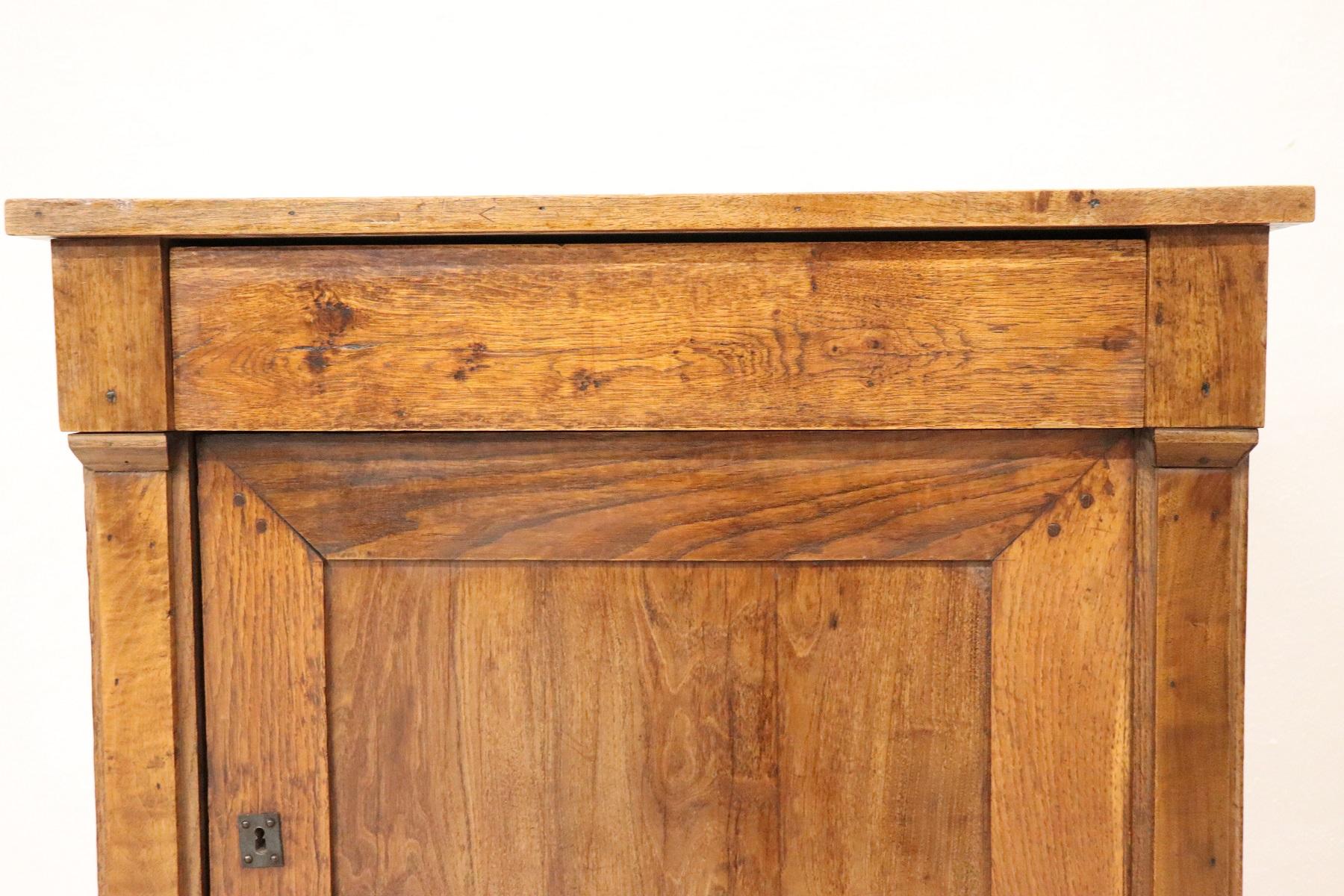 Particular small antique sideboard or cabinet in solid chestnut wood. Built in the second half of the nineteenth century empire line with feet with half pilasters on the front. Rustic furniture but very special for its small size suitable for any