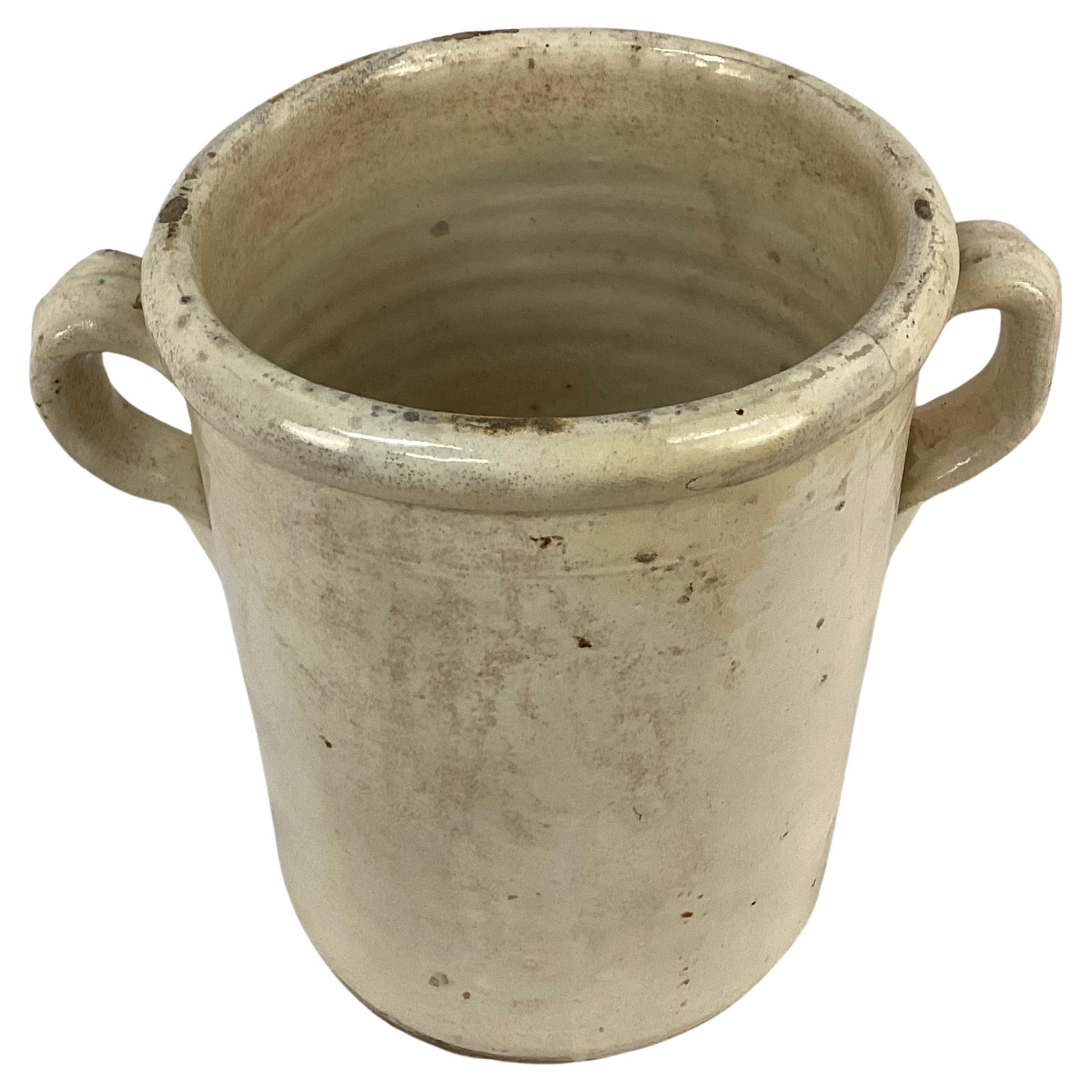 19th Century Italian ceramic chiminea preserve pot with handles. These pots were used to preserve food such as fruits, meat or vegetables. They were designed to be used in conjunction with wood-burning stove or fireplace as warmth helped preserve