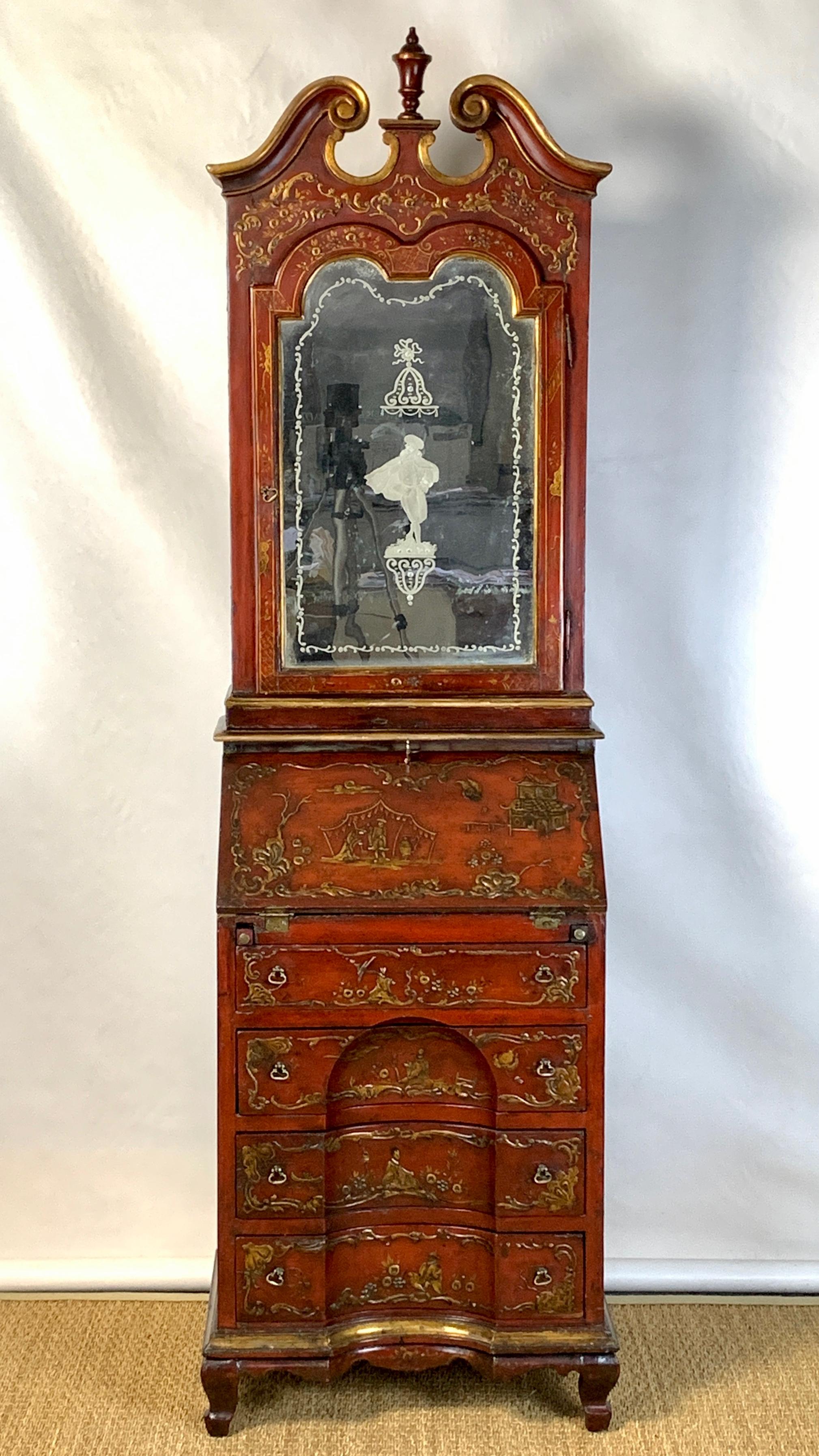 A small and elegant mid-19th century Italian scarlet chinoiserie decorated secretary desk of unusual diminutive size. The upper cabinet is inset with a beautifully carved Venetian mirror revealing elaborately decorated mustard yellow interior above