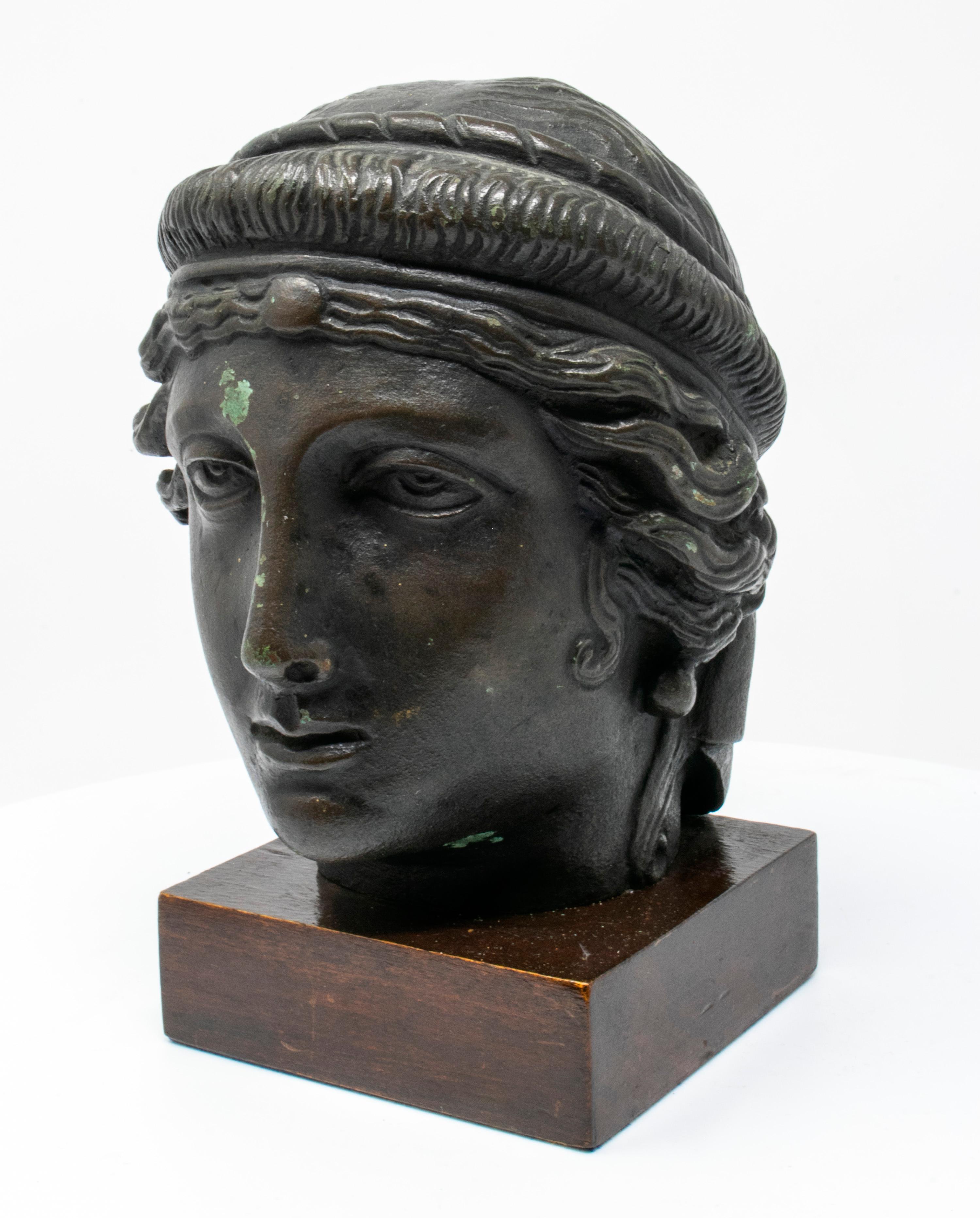 19th century Italian classical Greek bust in bronze on a wooden base.