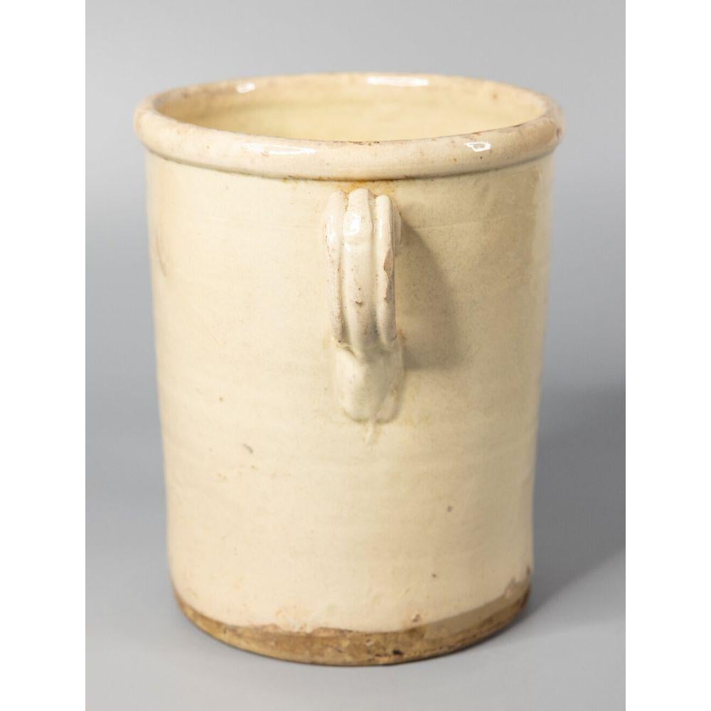 A large authentic 19th-Century Italian confit pot or jar. This pot is full of character, hand crafted and glazed with two charming handles, known as 'ears'. These jars were used for storing and preserving cooked meat. It would be beautiful with a