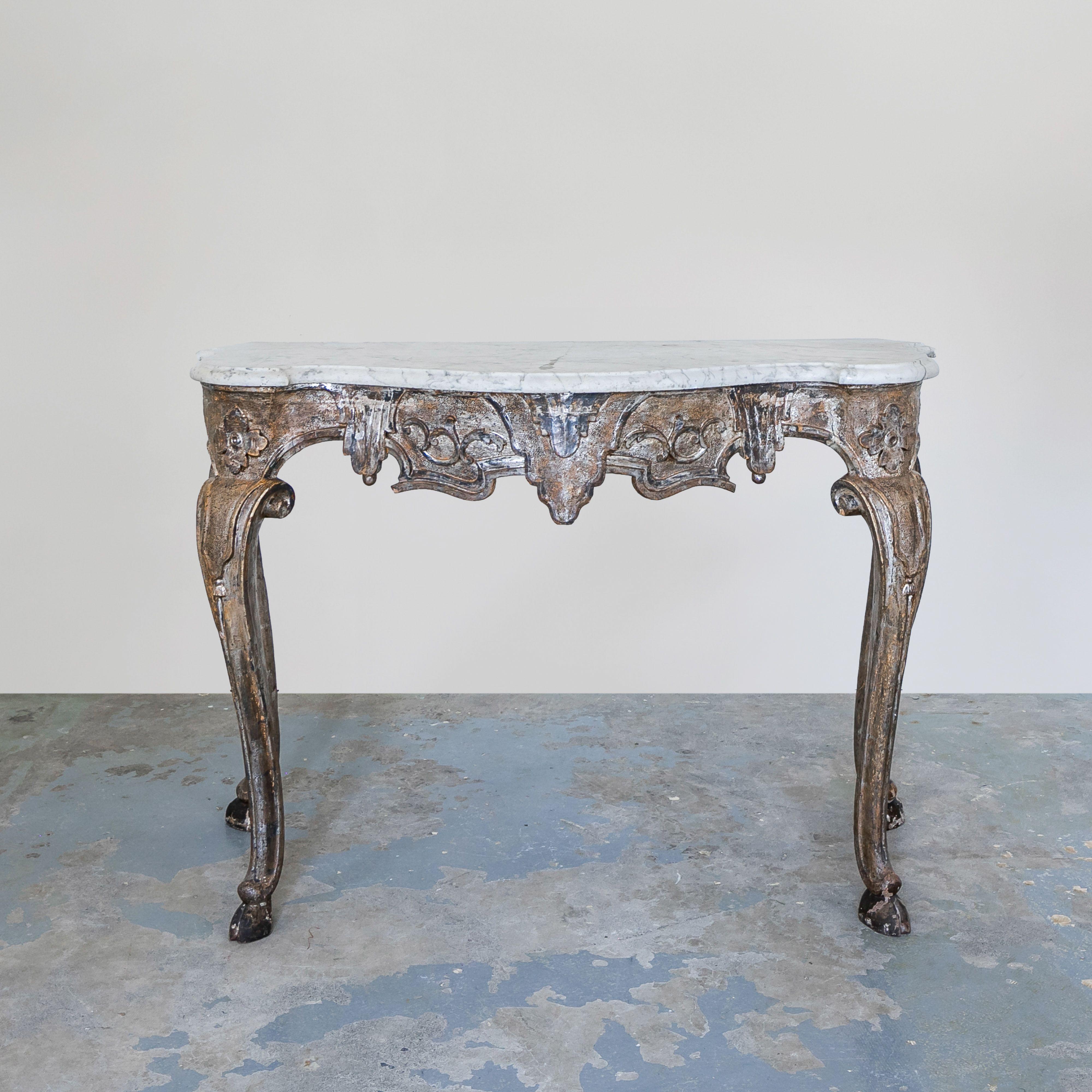 Italian Marble Console Table. Exquisitely hand carved wood table with floral details, carved tassels and animal 