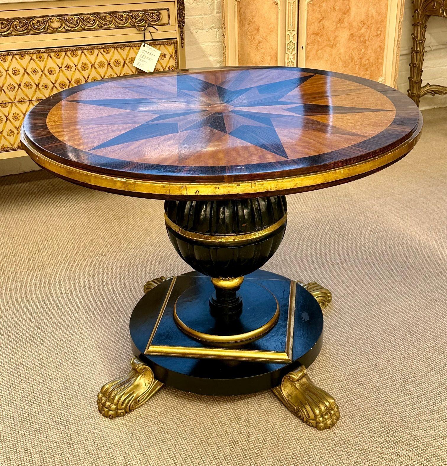 19th Century Italian Continental Centre Table, End or Card Table, Bronze Feet
Regal Mahogany and Macassar Ebony Circular Centre, Card or Hall Table with intricate starburst inlaid top, sitting on ebonized and gilded stand, raised on solid gilt