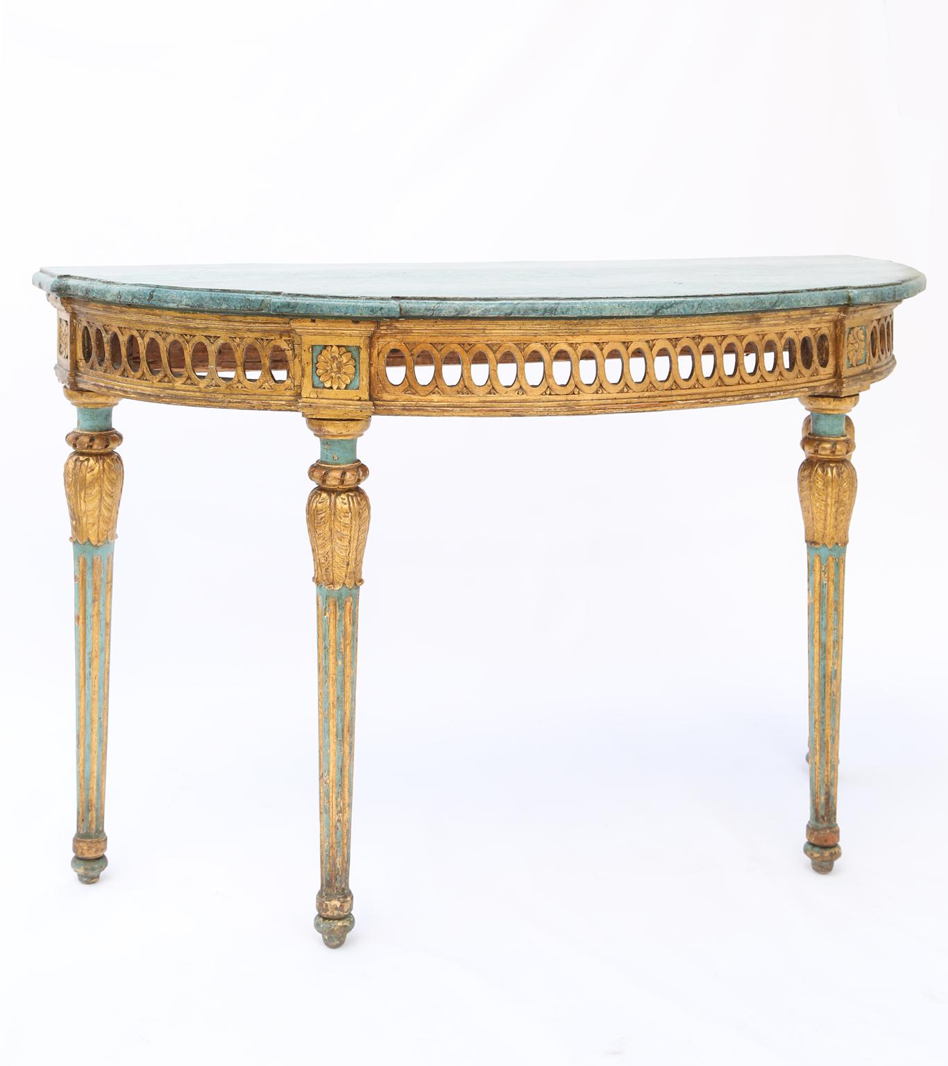 Demilune console, having a molded top, faux painted in robin's egg blue, its pierced, guilloche apron framed by rosette-blocks, raised on four, foliate-headed, round, tapering, and fluted legs, ending in touipe feet.

Stock ID: D2022.