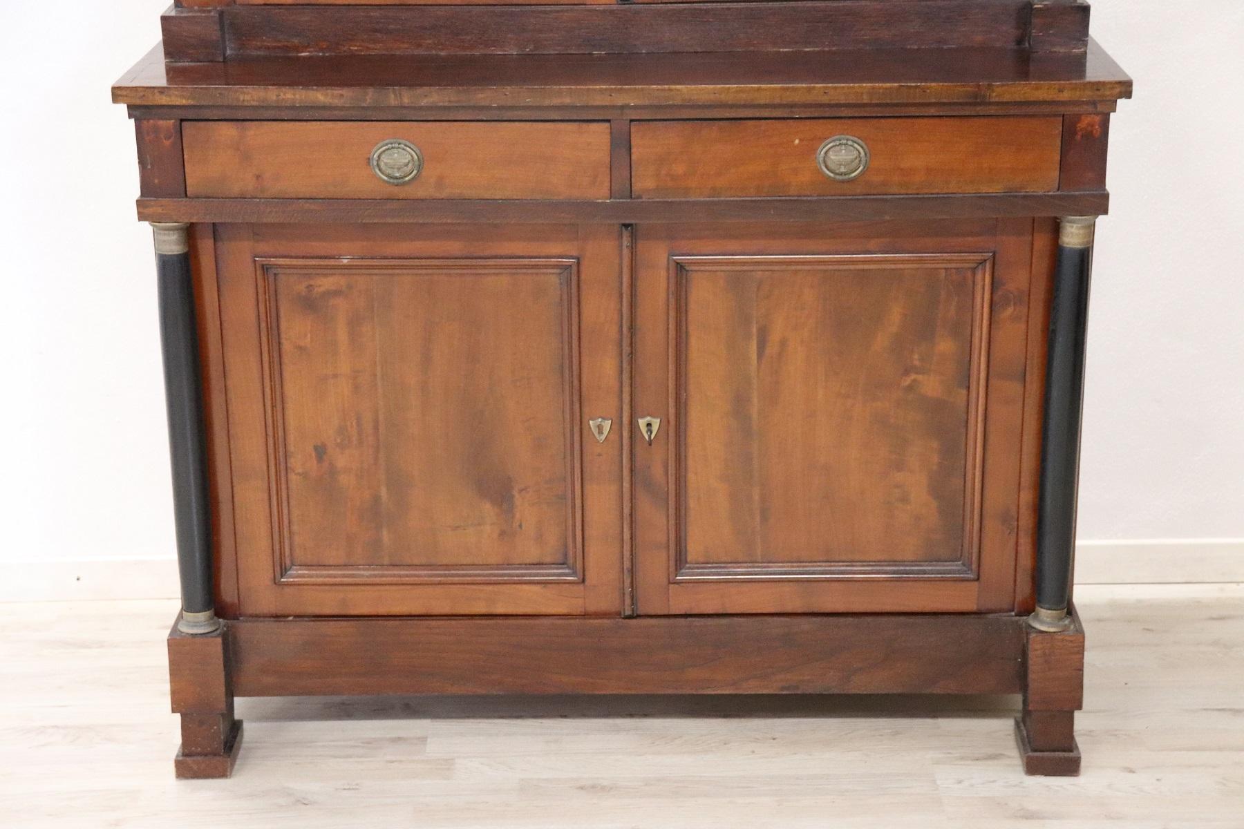 Antique double body sideboard first half of 1800 sec. XIX in solid cherrywood of a beautiful ancient patina! Italian sideboard from the Piedmontese line full Empire era with full ebonized columns the front panels are presented squared in the upper