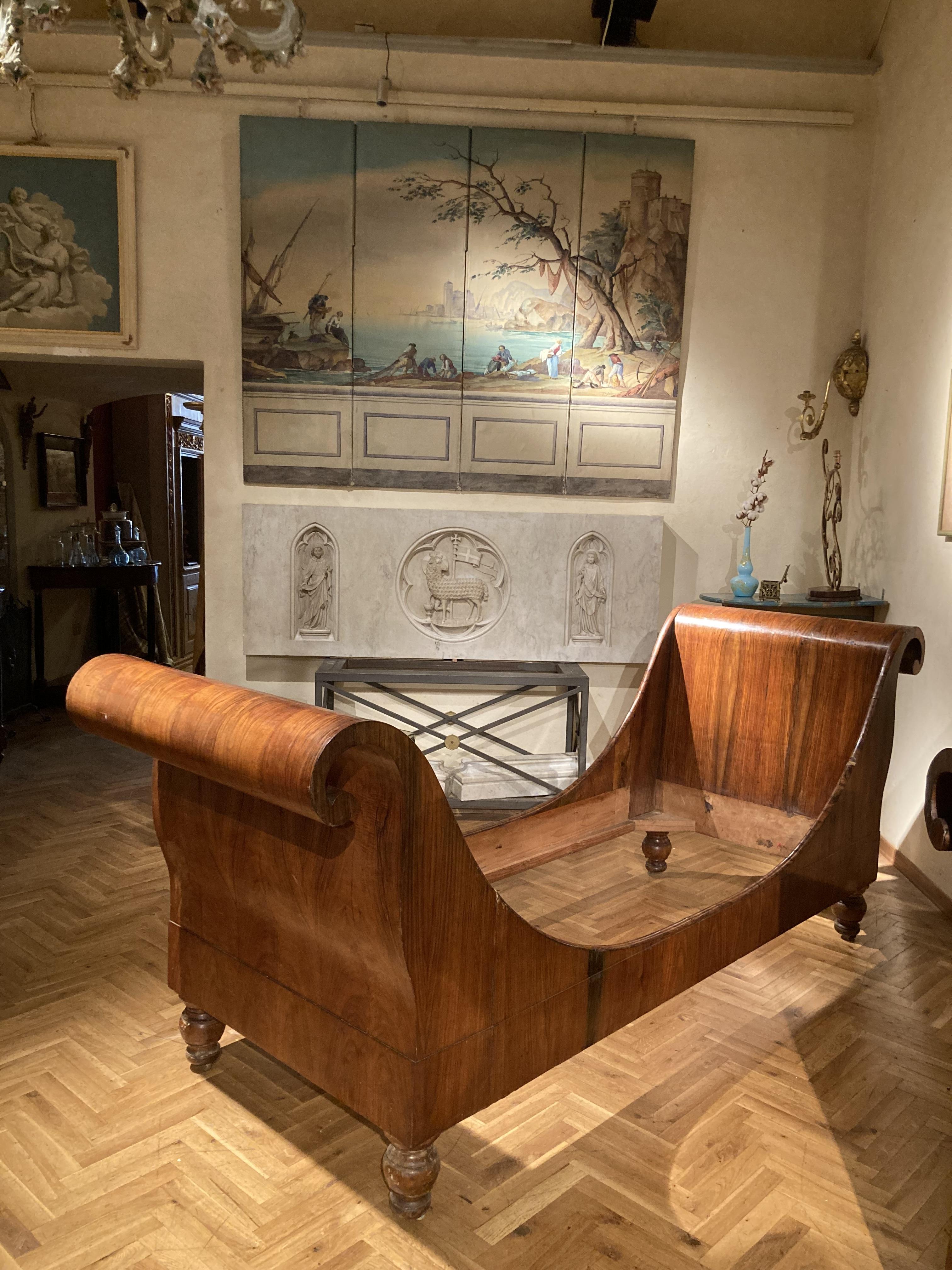These two exceptional Italian 19th century Empire period sleigh beds dating back to 1790-1830 were sourced in Lucca, Tuscany. The beds, that can serve also as a daybeds or settee, show a sophisticated execution sign of high quality cabinet making.