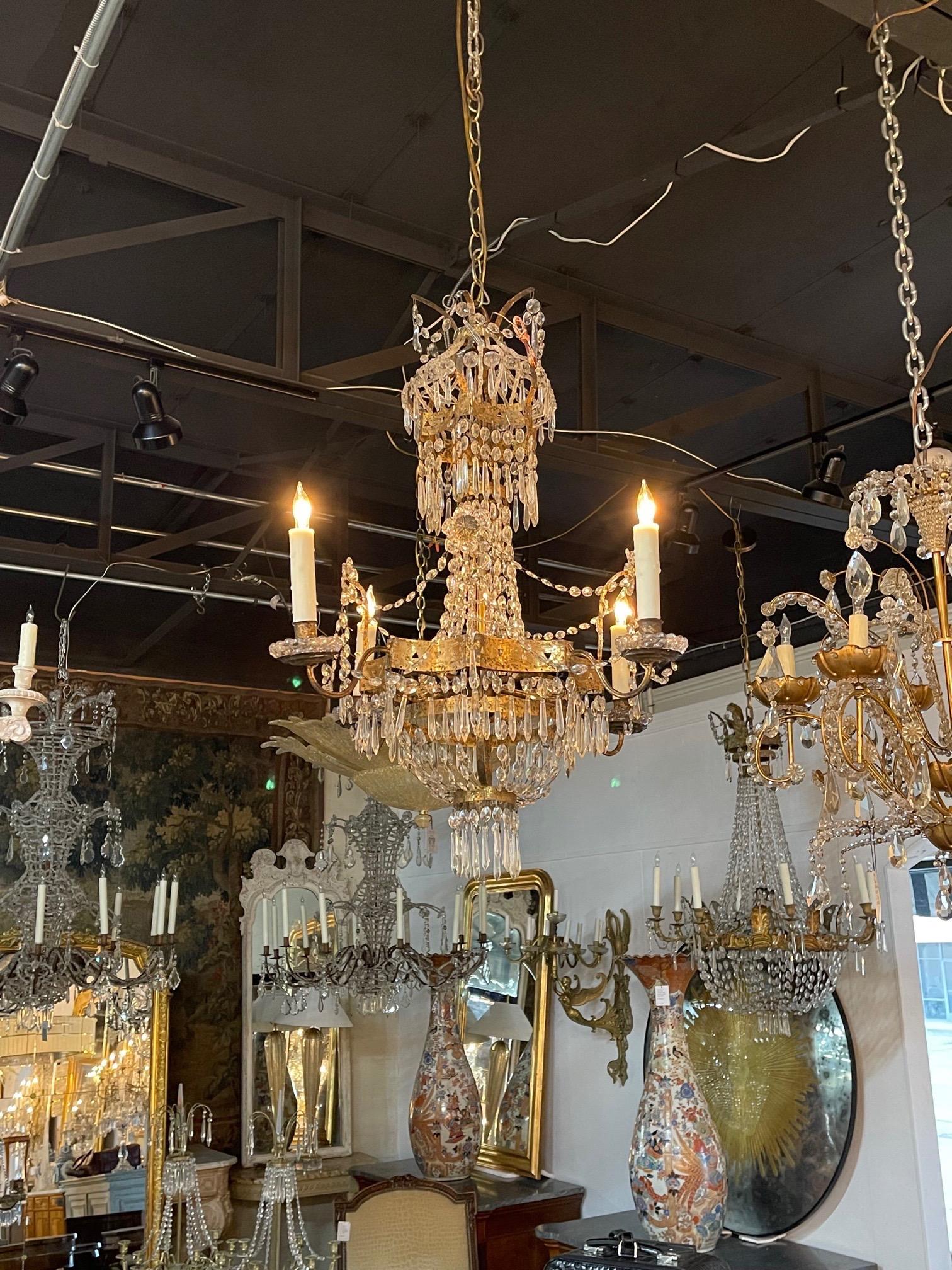 Beautiful 19th century Italian empire style crystal and tole chandelier with 4 lights. Covered in gorgeous crystals. Super elegant!