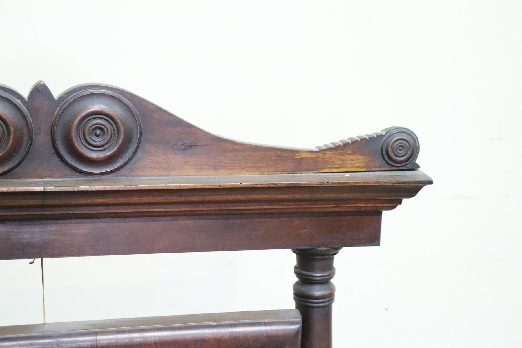 Beautiful antique table mirror in carved walnut. On the sides the mirror is supported by two columns. On the front two drawers. Antique mercury mirror.
The antique nightstand have been used need of restoration as you can see from the wear defects