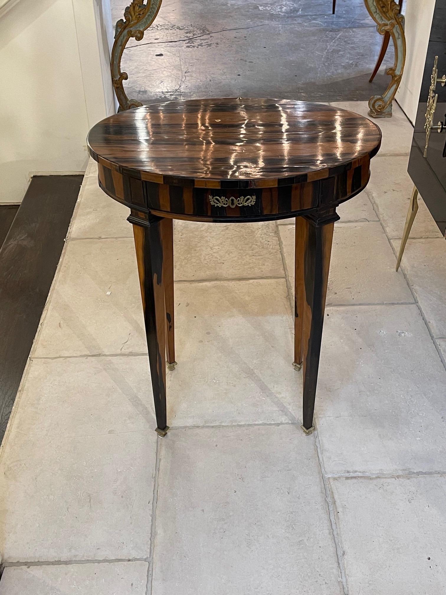 Handsome 19th century Italian Exotic Madagascar round wood side table. Beautiful finish and variation in the wood. Pretty brass details as well. So elegant!