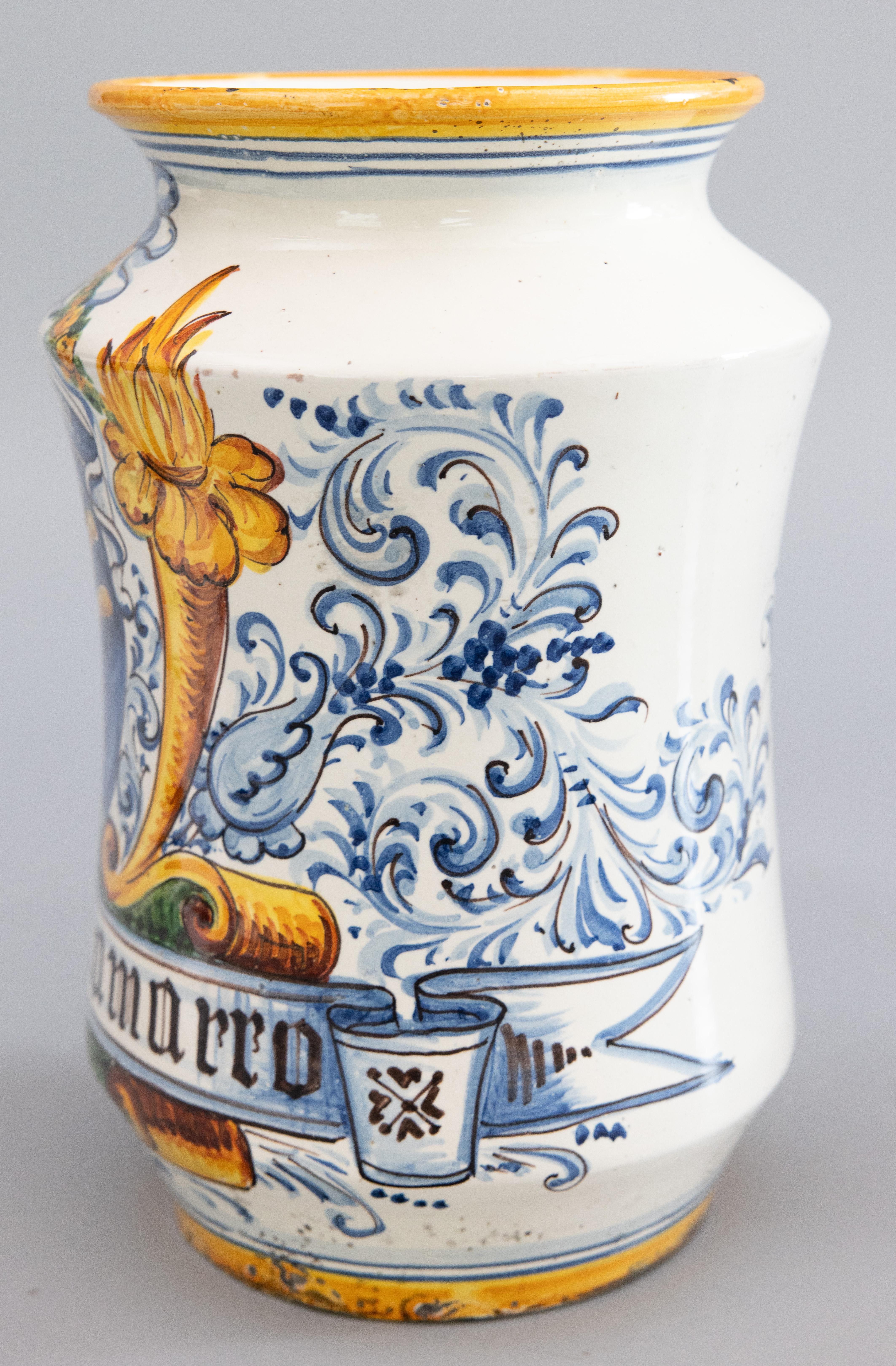 A lovely antique 19th-Century Italian faience albarello or apothecary pharmacy jar. This fine jar has a hand painted lion surrounded by ornamental scrolls in vibrant colors. It displays beautifully and would be wonderful used as a vase with a