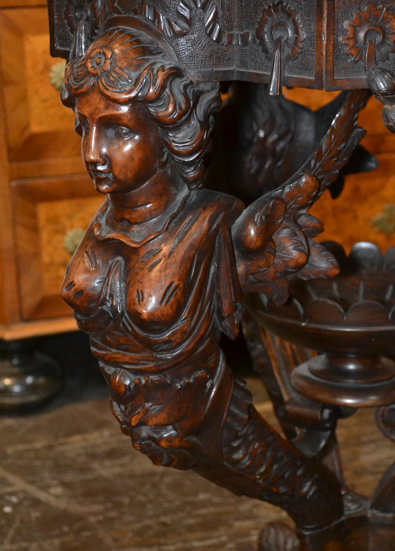 Handsome 19th century Italian carved walnut figural side table with beautiful specimen marble-top.
