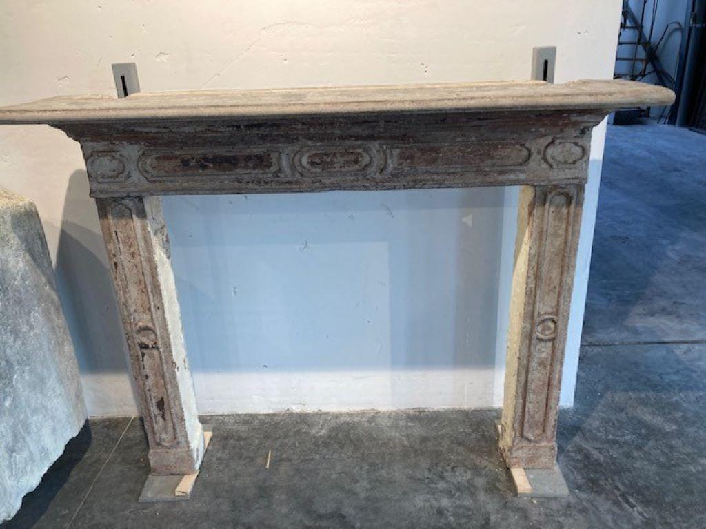 Original Ciment fireplace mantel from Italy and dating from the 19th century.
Inside dimensions : 98cm wide & 90cm high