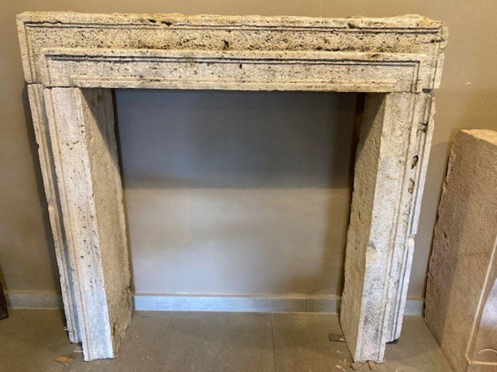 Very original fireplace mantel made from Italian travertine and dating from the 19th century.
Inside dimensions : 90cm wide & 101cm high