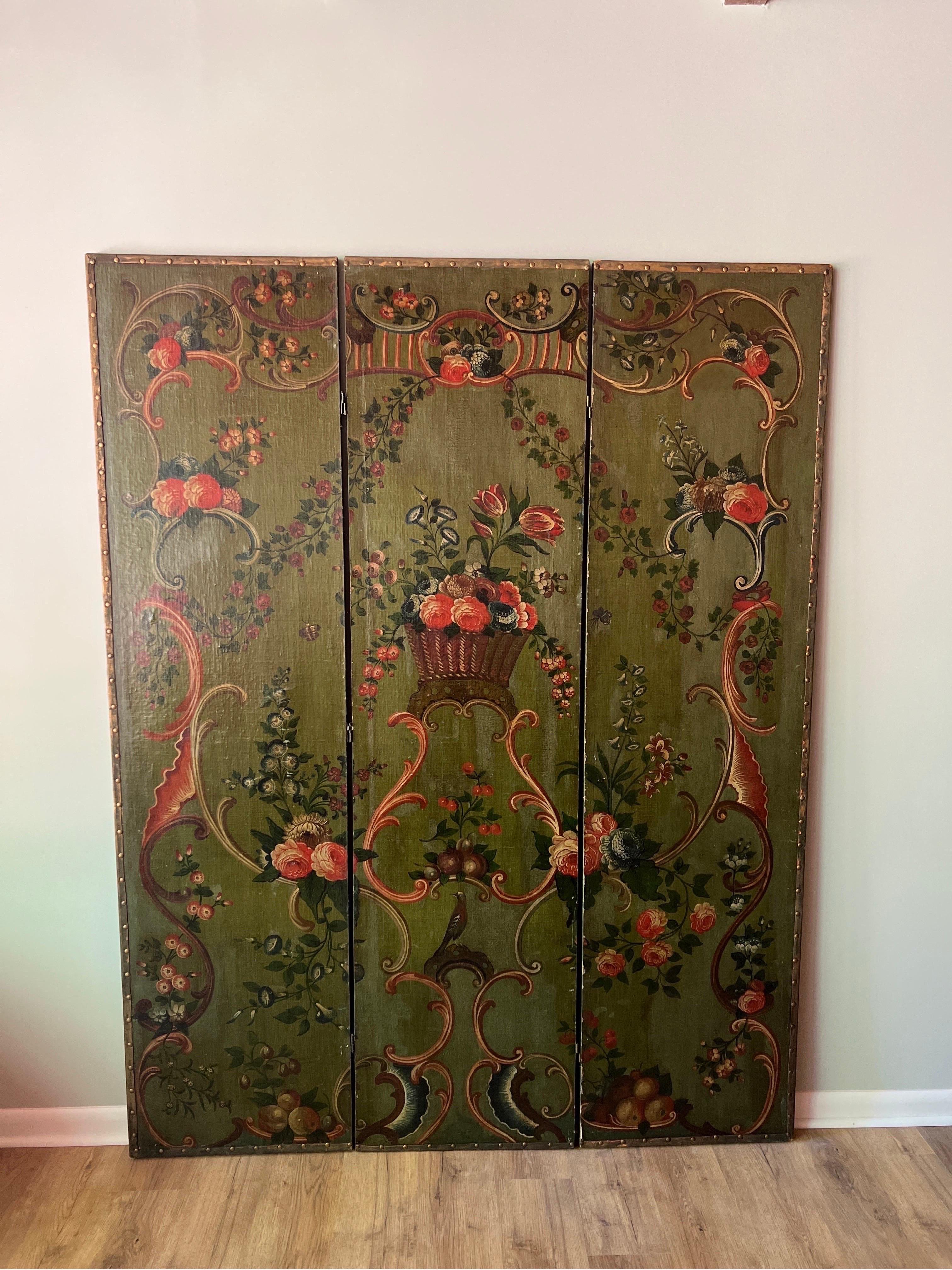 Antique 19th century Italian Floral Painted 3 panel folding floor screen / room divider.
The screen has been expertly painted by an Italian school artist. Decorated with floral and foliate images, a Rococo influence with scroll work to the edges.