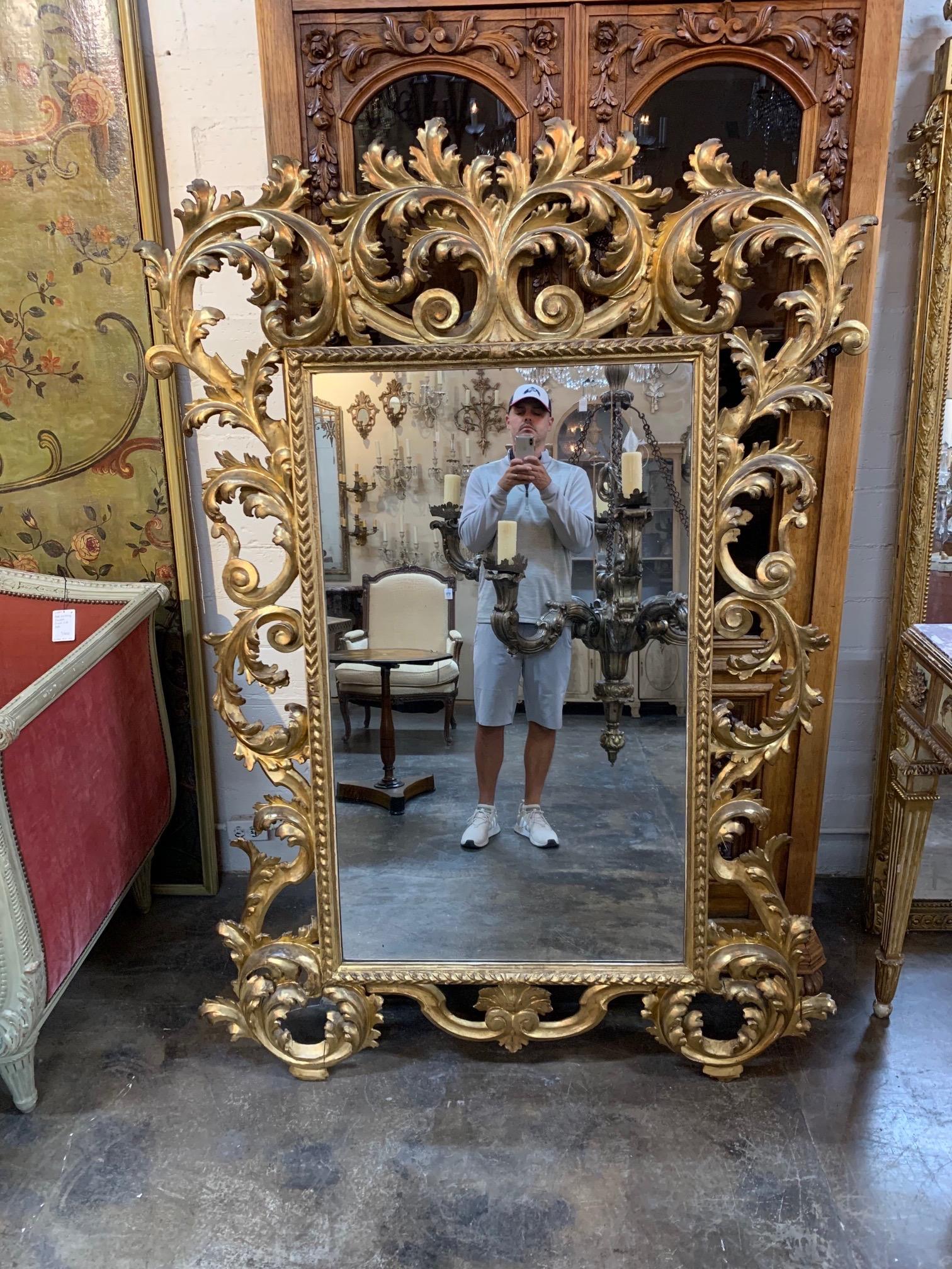 Large scale fabulous 19th century Italian Florentine carved and giltwood mirror. Very fine carvings and gilt on this piece. Makes an impressive focal point. Exquisite!
