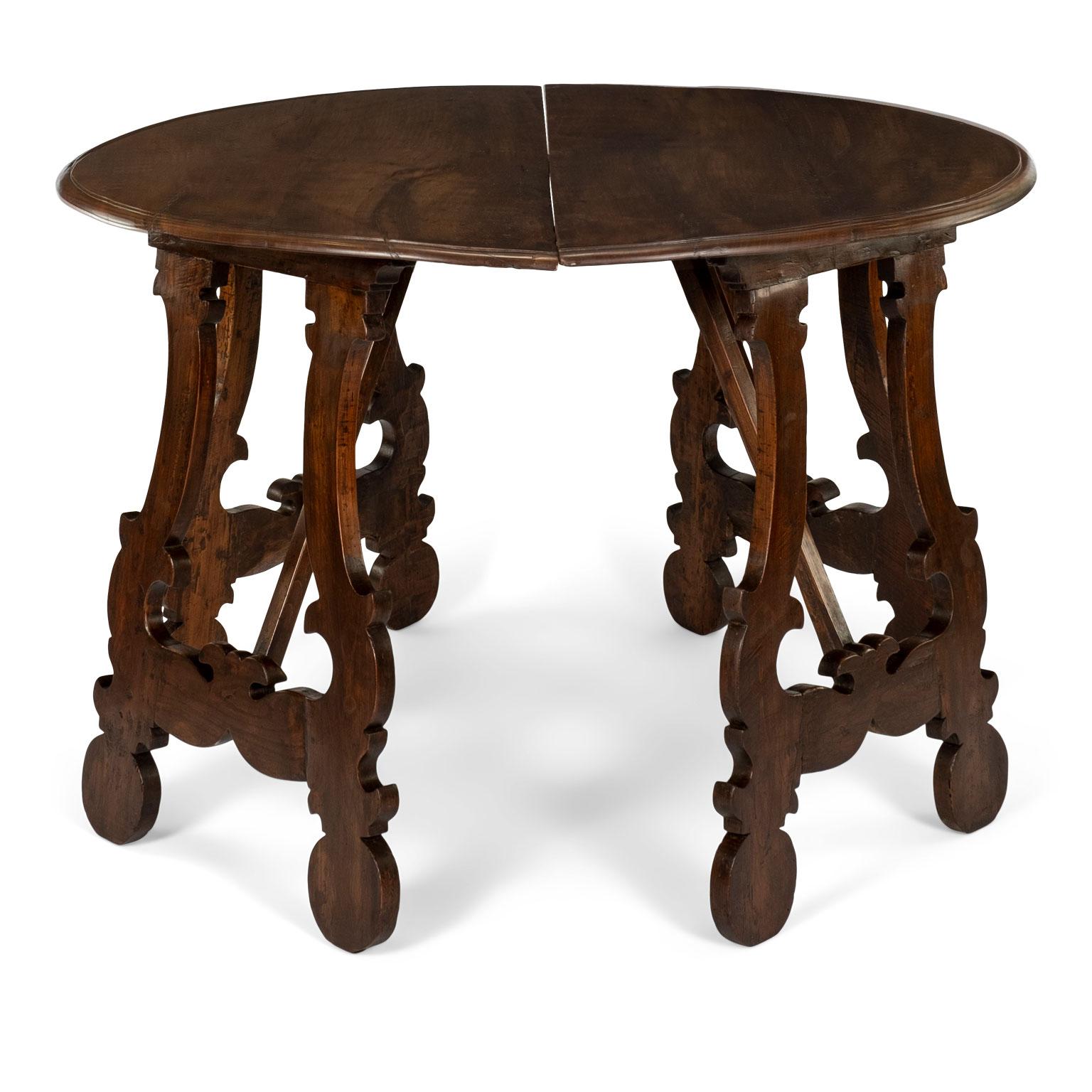 19th century Italian fruitwood demilune consoles: half-moon tops raised upon double lyre shaped bases.