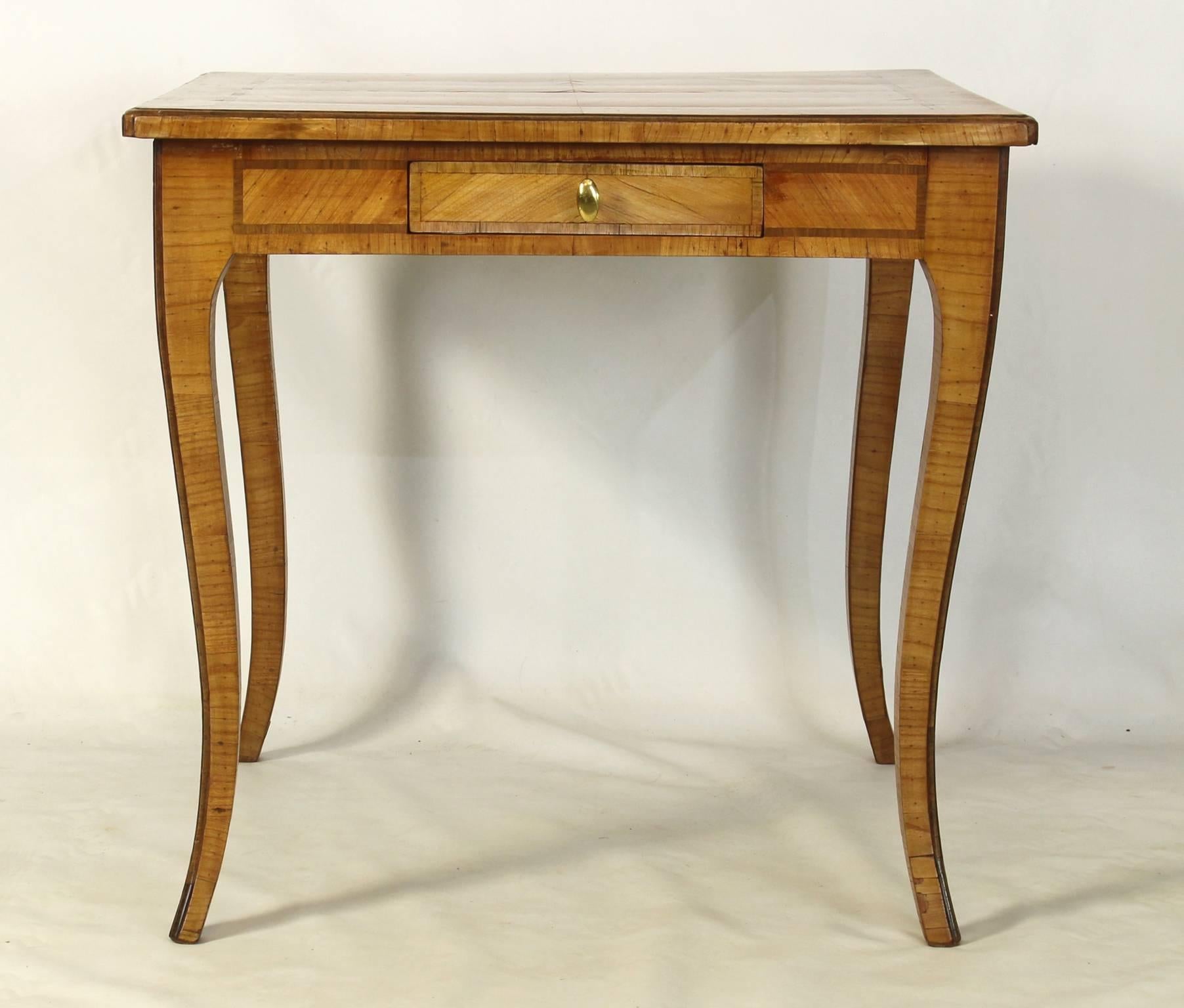 A late 19th century Italian fruitwood card or games table with single drawer and elegant tapering cabriole legs.