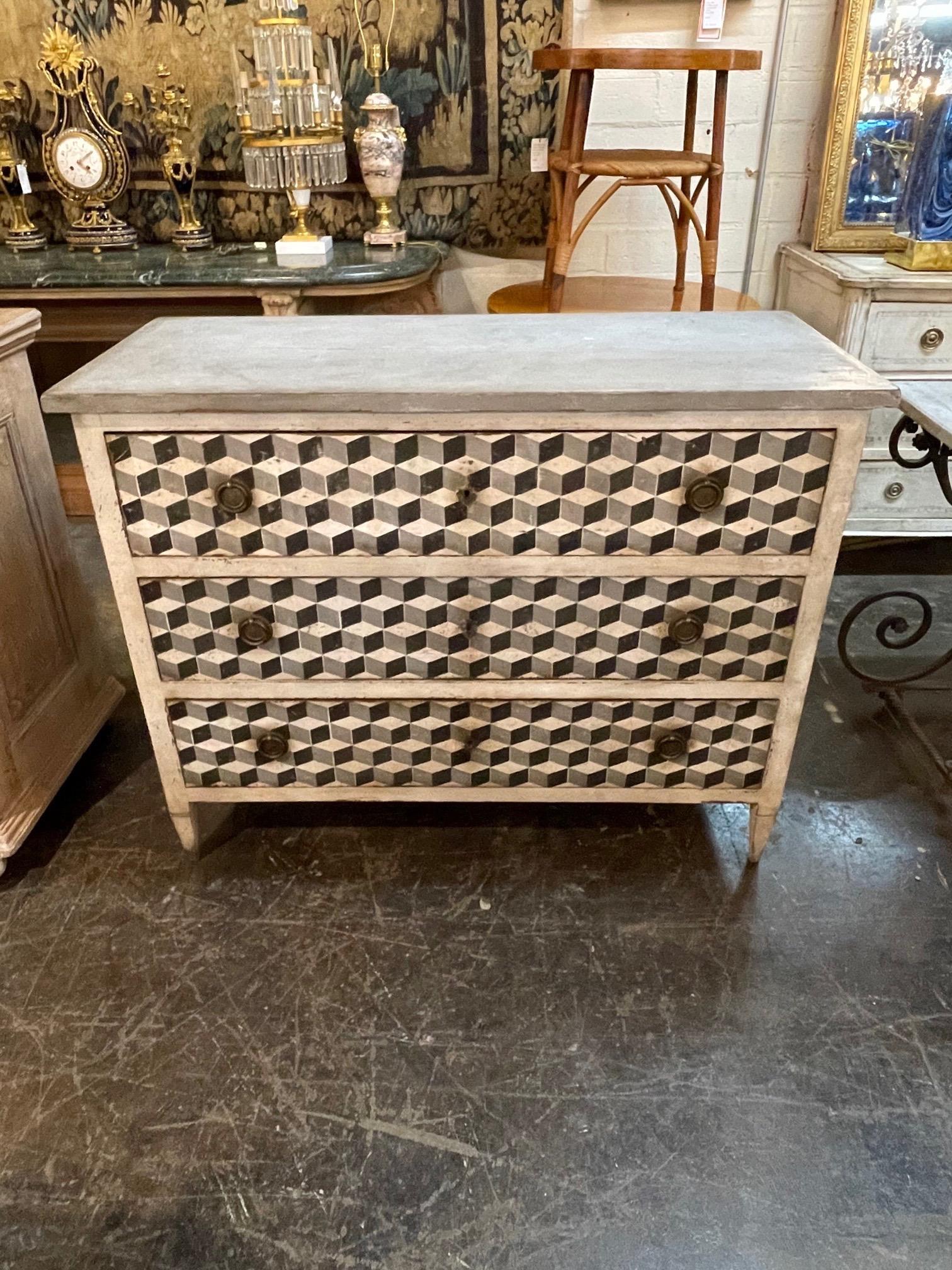 Fabulous 19th century Italian commode with a hand painted geometric design in colors of black, white and grey. The design has a real 3 - D look to it. A real conversation piece that adds a touch of pizzazz to your decor!