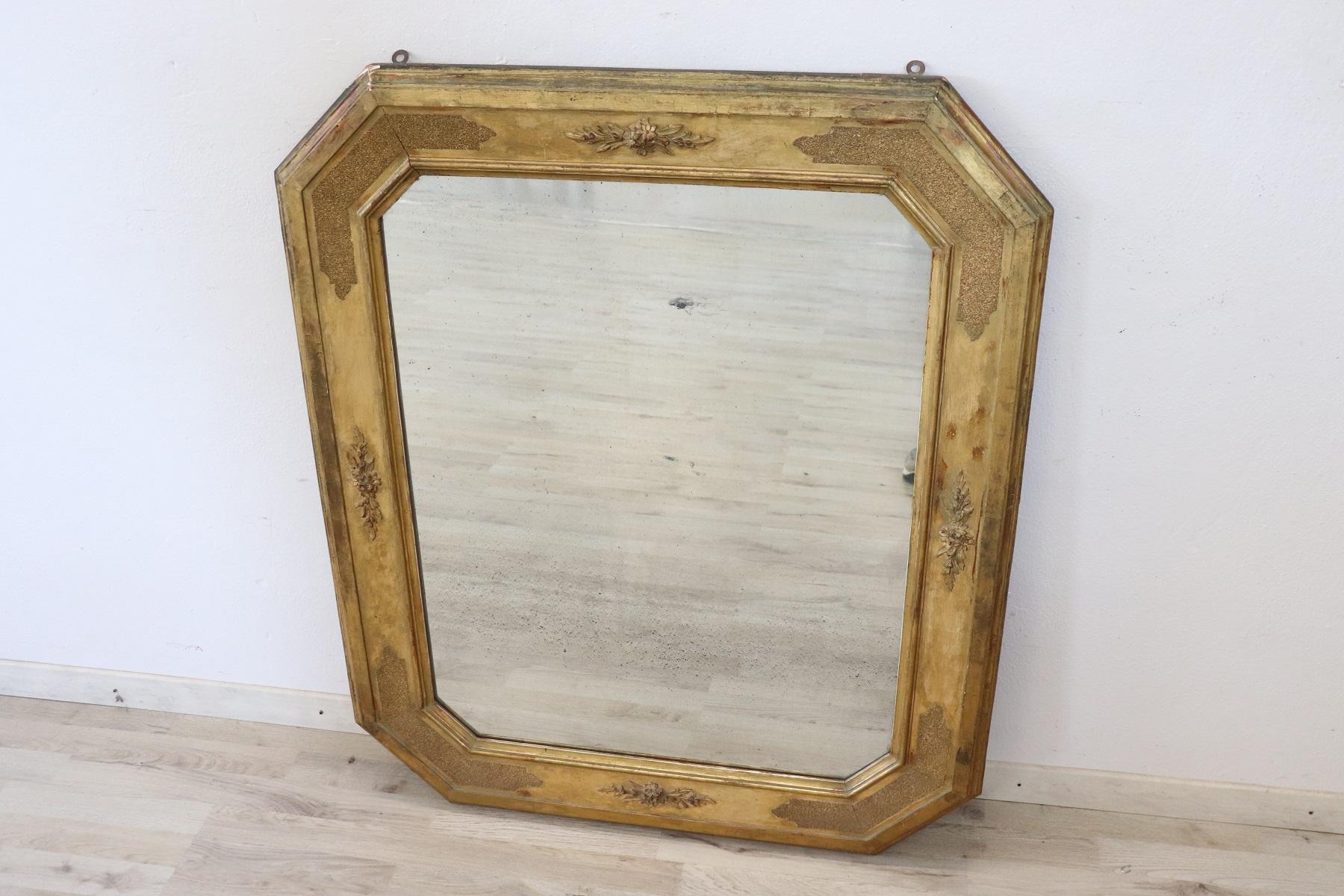 Elegant 19th century Italian antique gilded wood wall mirror 1850s with refined decoration. Used conditions. Elegant in every room of your home.