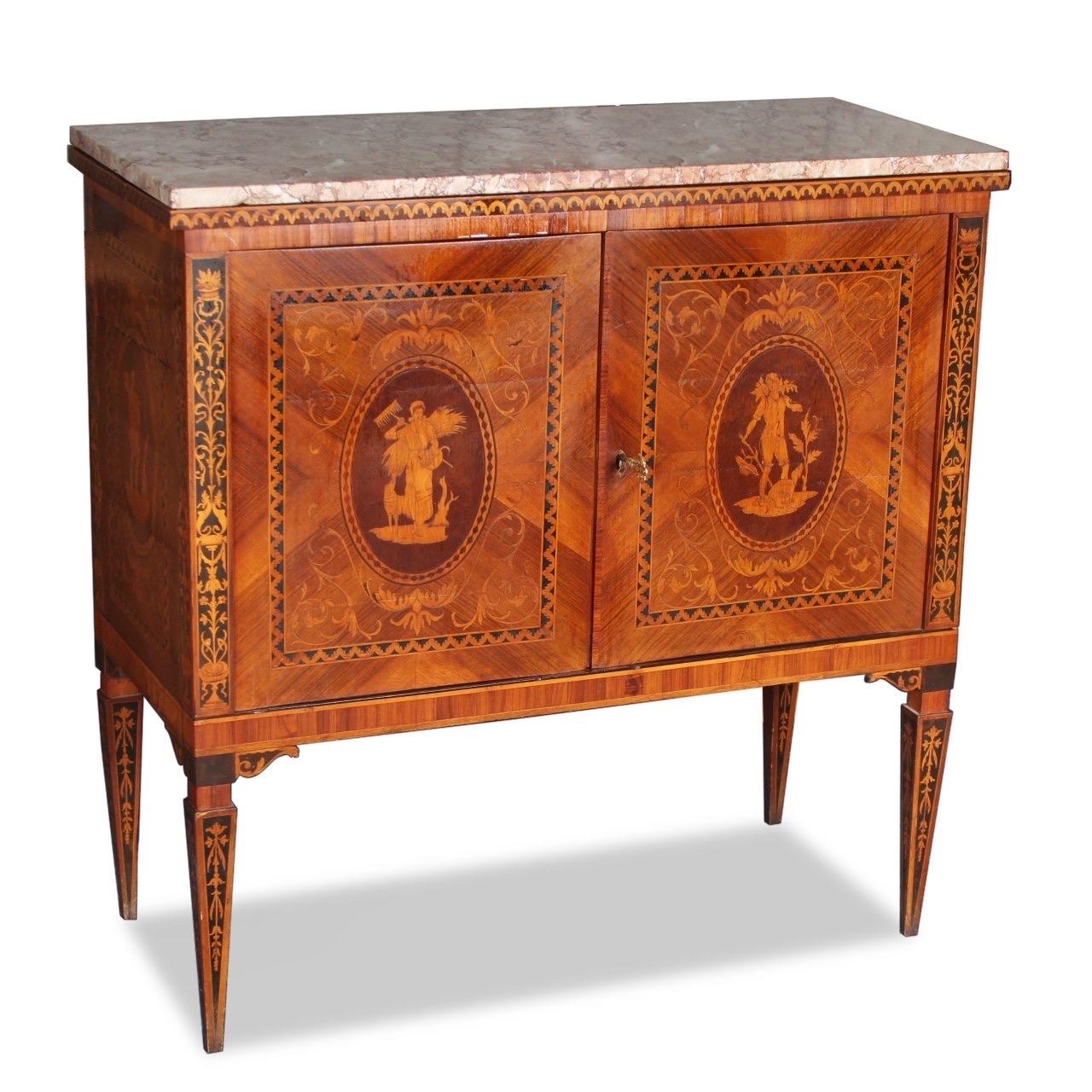 An antique Italian bar inlaid throughout with a rich, warm finish in walnut and palisander wood with neoclassical marquetry inlay, gilt accents and a cream ivory and rouge marble top. 

Handcrafted in Italy in the 19th century in the Italian