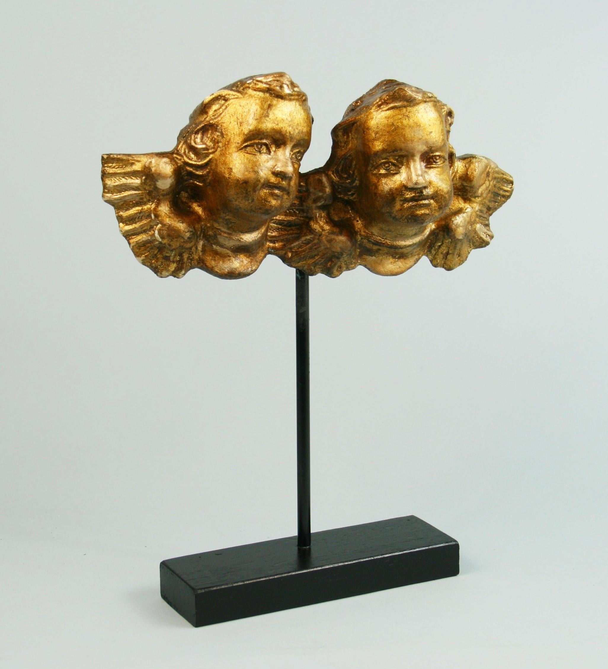 3-549, hand carved Italian putti mounted on stand.